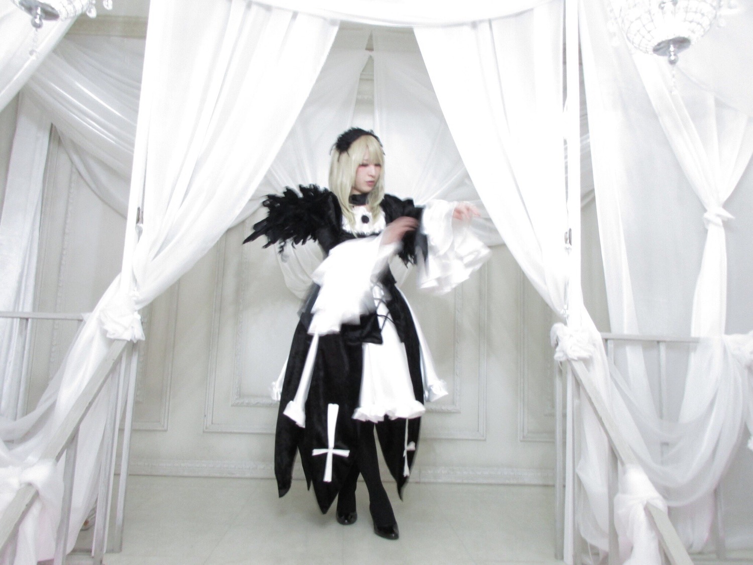 1girl blonde_hair cape curtain_grab curtains indoors solo standing suigintou white_hair window