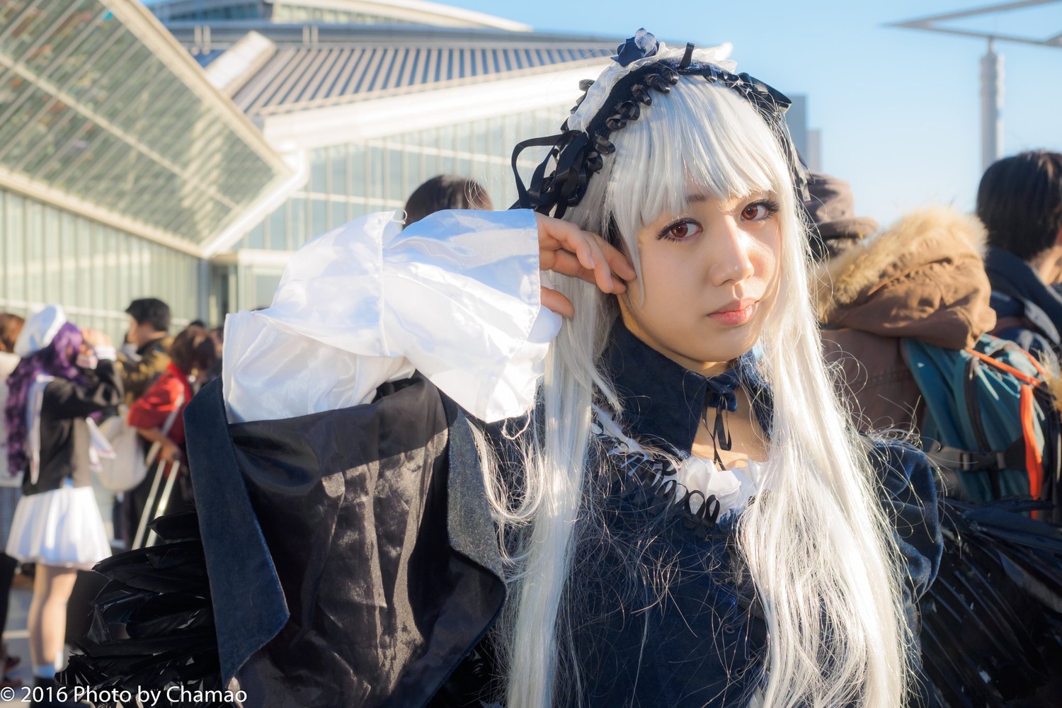 3d 6+boys blurry blurry_background blurry_foreground building city day depth_of_field hairband lolita_fashion long_hair long_sleeves looking_at_viewer multiple_boys multiple_girls outdoors photo realistic red_eyes solo solo_focus suigintou