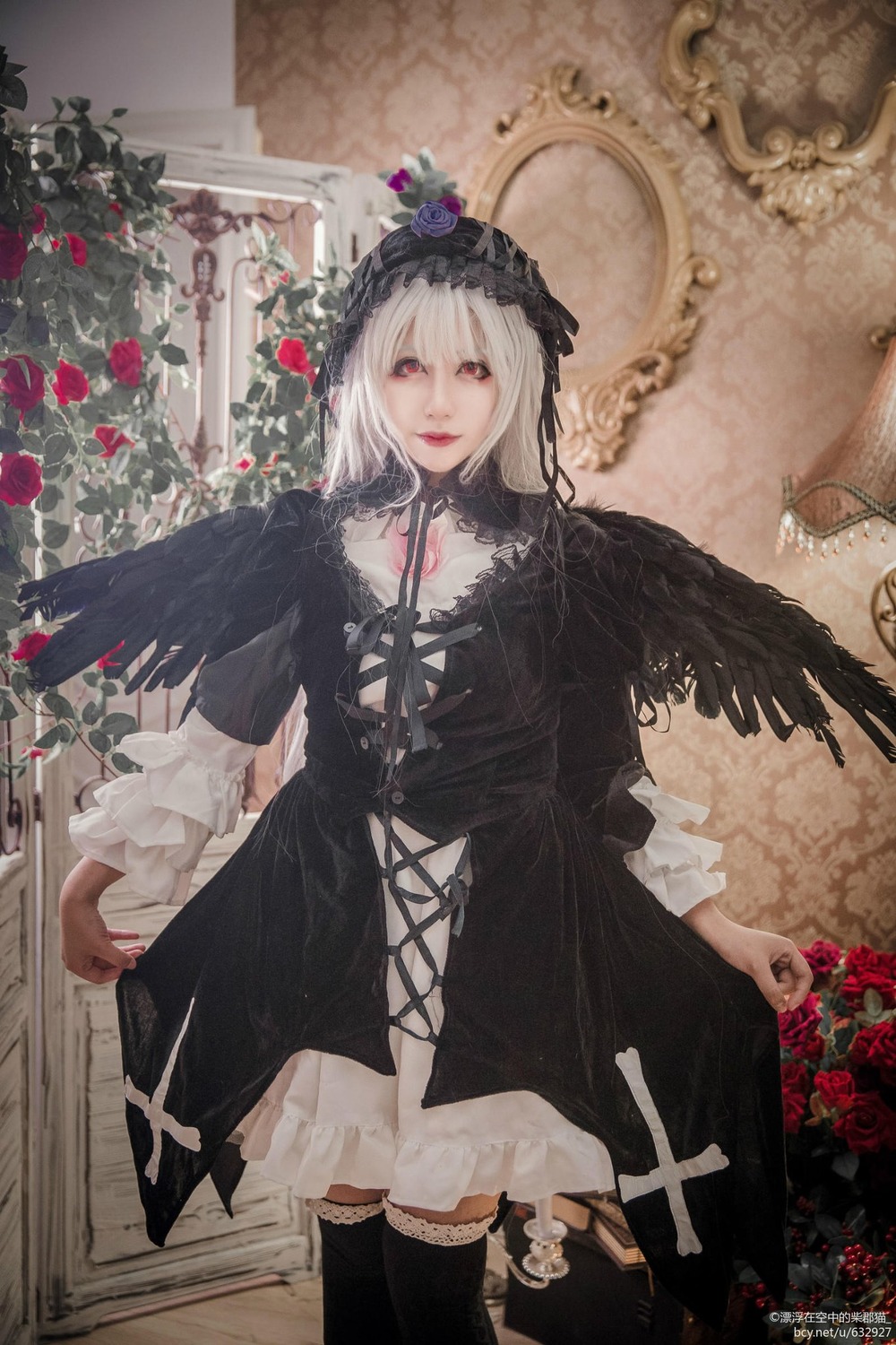 1girl black_dress black_wings dress flower gothic_lolita hairband lolita_fashion long_sleeves looking_at_viewer red_eyes red_flower rose silver_hair solo suigintou wings