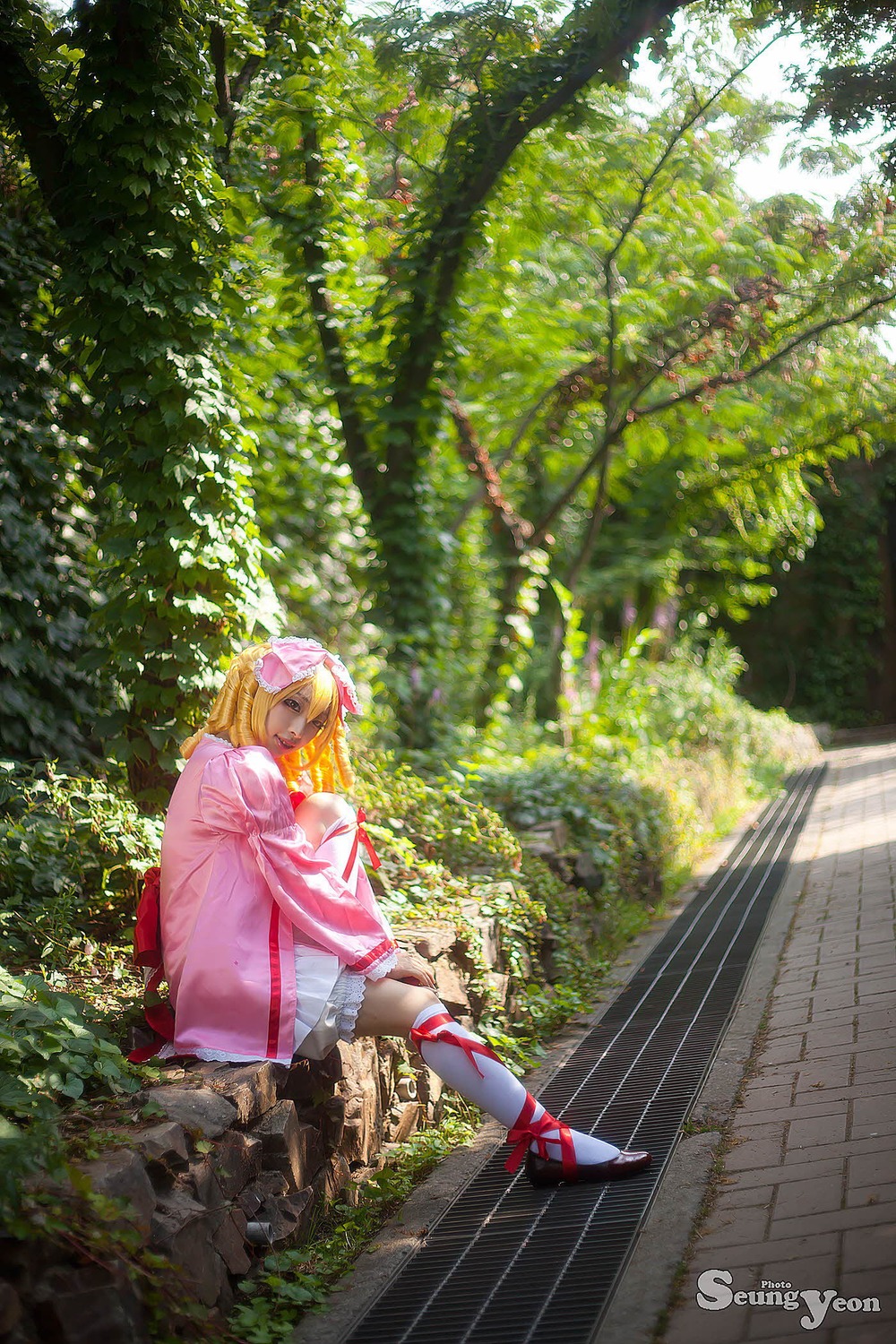 1girl blonde_hair bow closed_eyes day hinaichigo long_hair outdoors solo sunlight tree