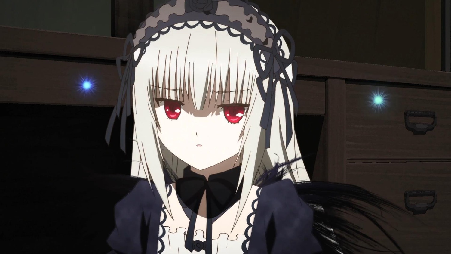 1girl bangs black_ribbon black_wings closed_mouth detached_collar dress eyebrows_visible_through_hair flower hairband image indoors long_hair looking_at_viewer red_eyes ribbon silver_hair solo suigintou