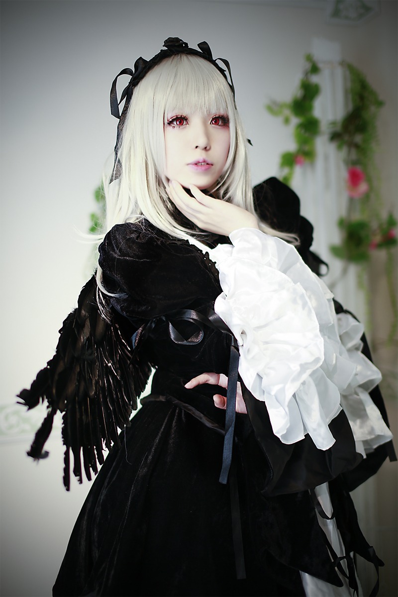 1girl 3d bangs black_dress blurry blurry_background depth_of_field dress frills gothic_lolita hairband high_heels lips lolita_fashion long_hair long_sleeves looking_at_viewer nail_polish photo red_eyes solo standing suigintou