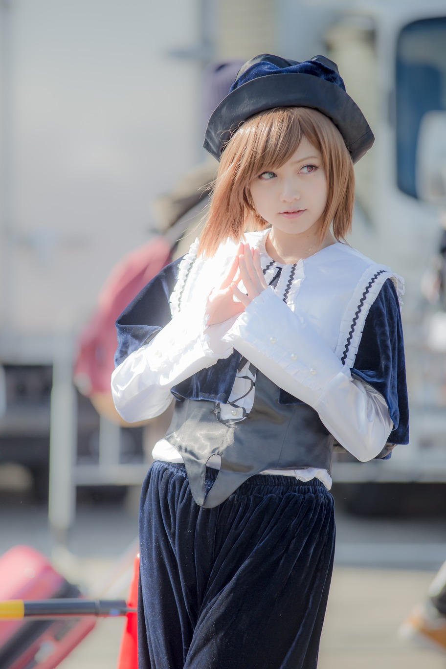 1girl 3d blonde_hair blue_eyes blurry blurry_background blurry_foreground chair depth_of_field hat lips long_sleeves looking_at_viewer photo skirt solo souseiseki