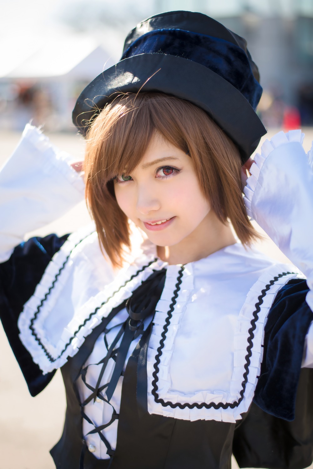 1girl 3d bangs blurry blurry_background brown_hair depth_of_field dress fur_trim hat heterochromia lace lips looking_at_viewer photo red_eyes short_hair solo souseiseki upper_body