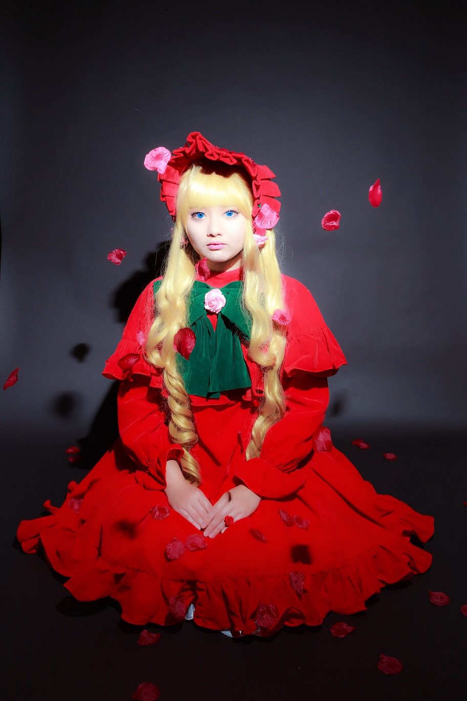 1girl blonde_hair blue_eyes bonnet capelet dress flower long_hair petals red_dress rose rose_petals shinku sitting solo twintails