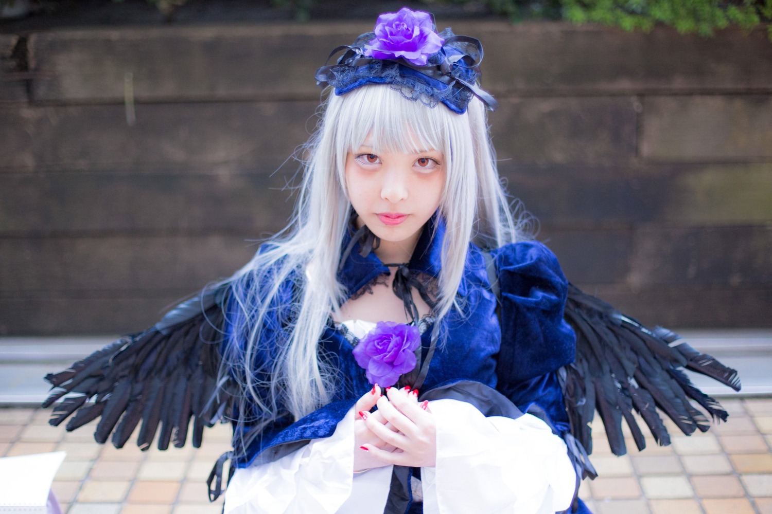 1girl bangs black_wings blurry blurry_background choker closed_mouth depth_of_field dress feathered_wings feathers flower lips long_hair long_sleeves looking_at_viewer nail_polish ribbon rose solo suigintou upper_body wings