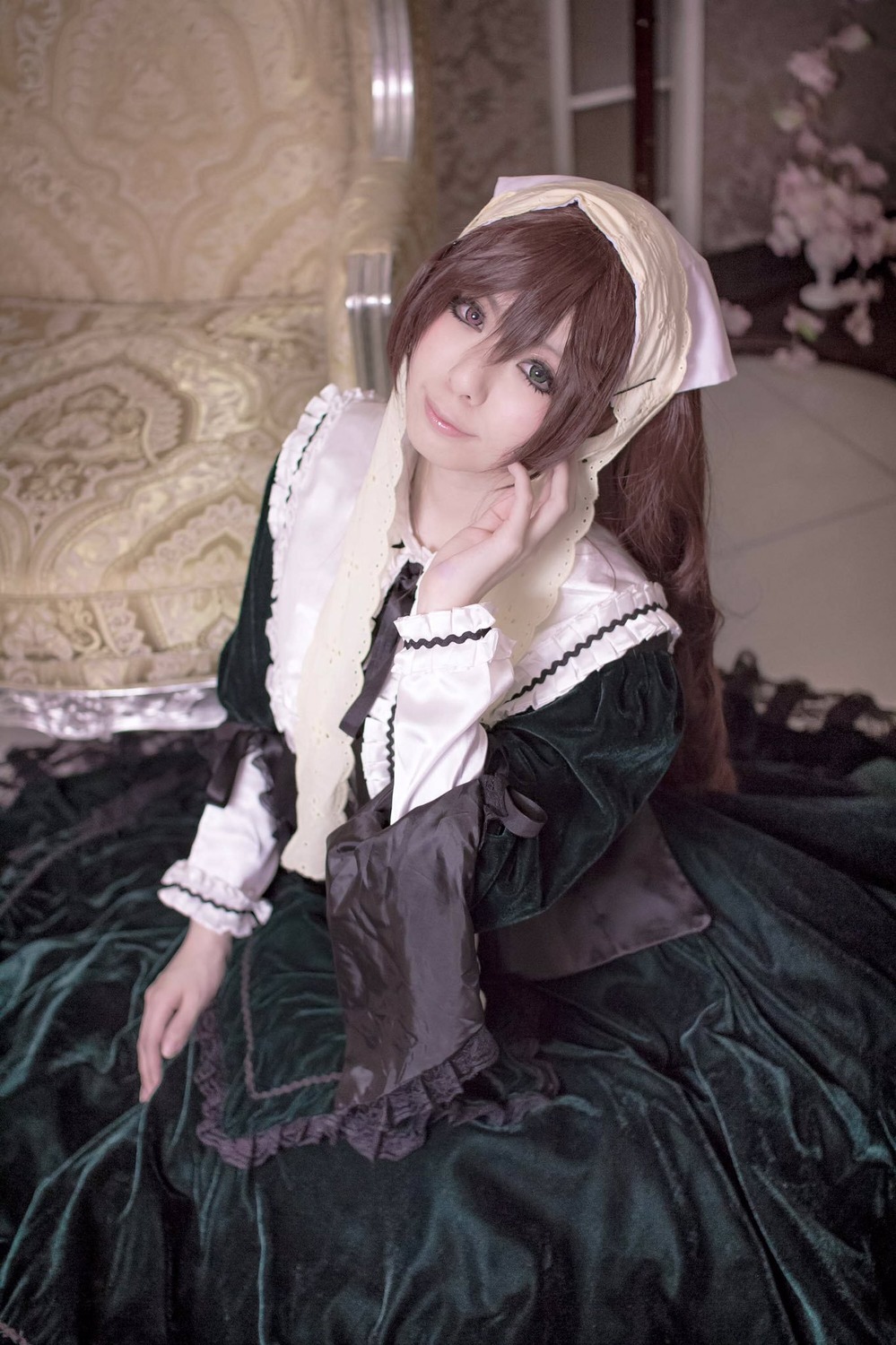 1girl brown_hair dress frills lace lips long_sleeves looking_at_viewer sitting smile solo suiseiseki