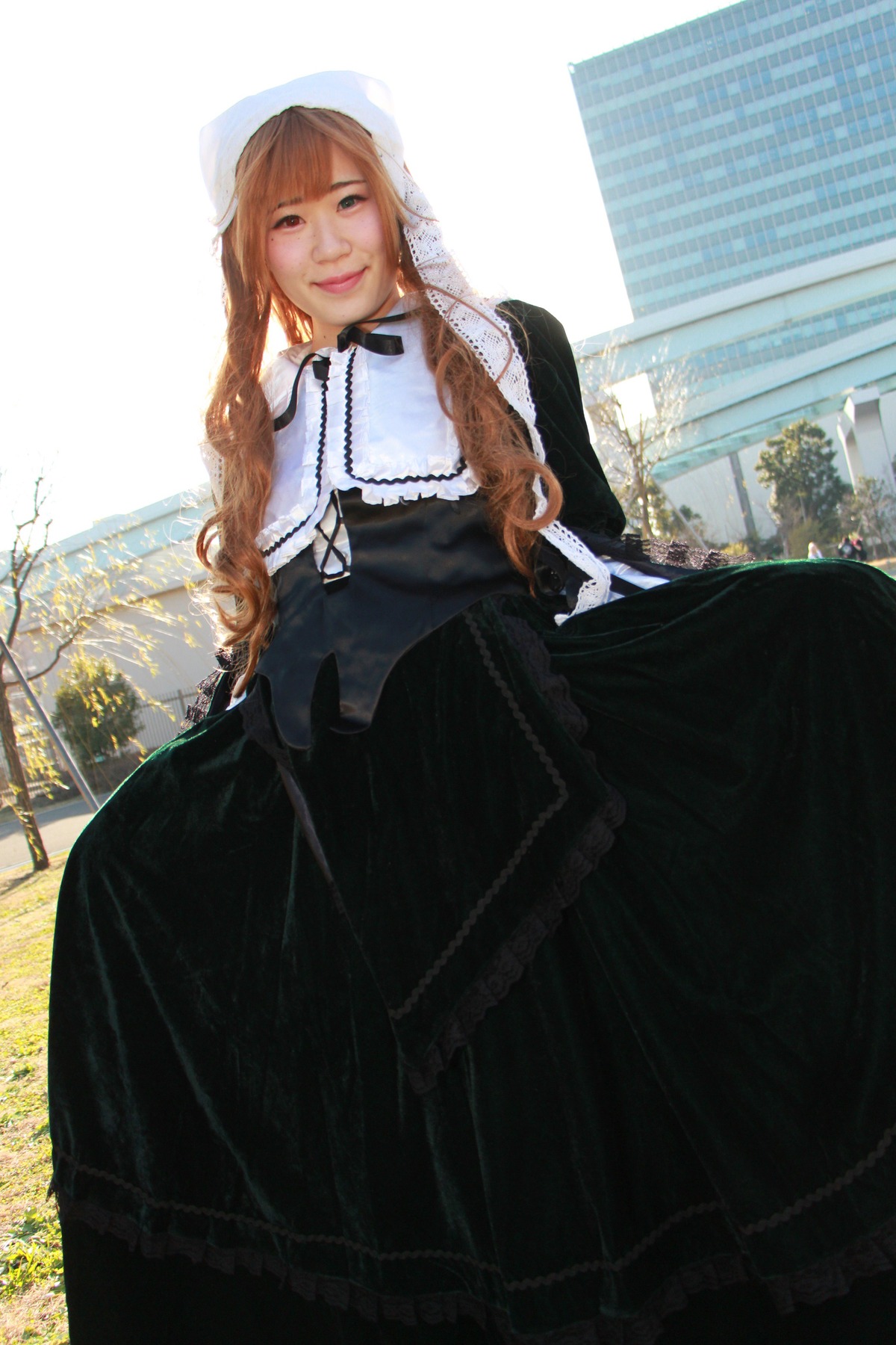 1girl bangs black_dress braid brown_hair day dress lips long_hair looking_at_viewer outdoors solo suiseiseki twin_braids