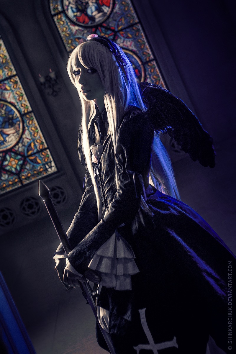 1girl black_dress blurry closed_mouth depth_of_field dress gothic gothic_lolita holding indoors long_hair long_sleeves profile solo stained_glass standing suigintou white_hair