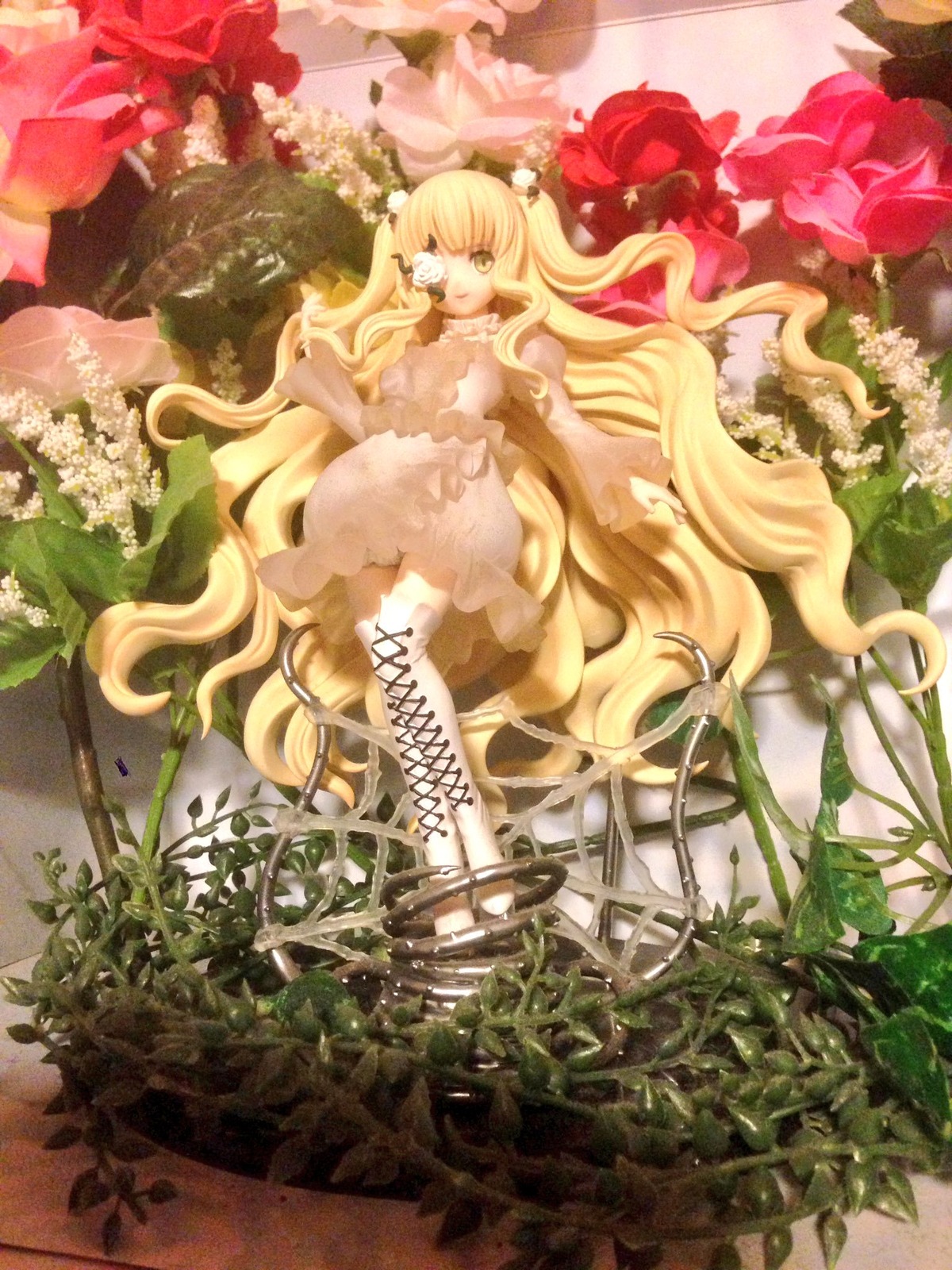 1girl blonde_hair boots cross-laced_footwear doll dress eyepatch flower frills kirakishou long_hair plant rose sitting solo thorns traditional_media very_long_hair vines yellow_eyes