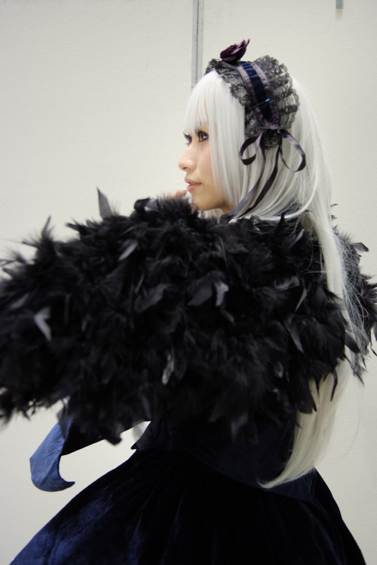 1girl closed_mouth feathers gothic_lolita hairband lips profile solo suigintou white_hair