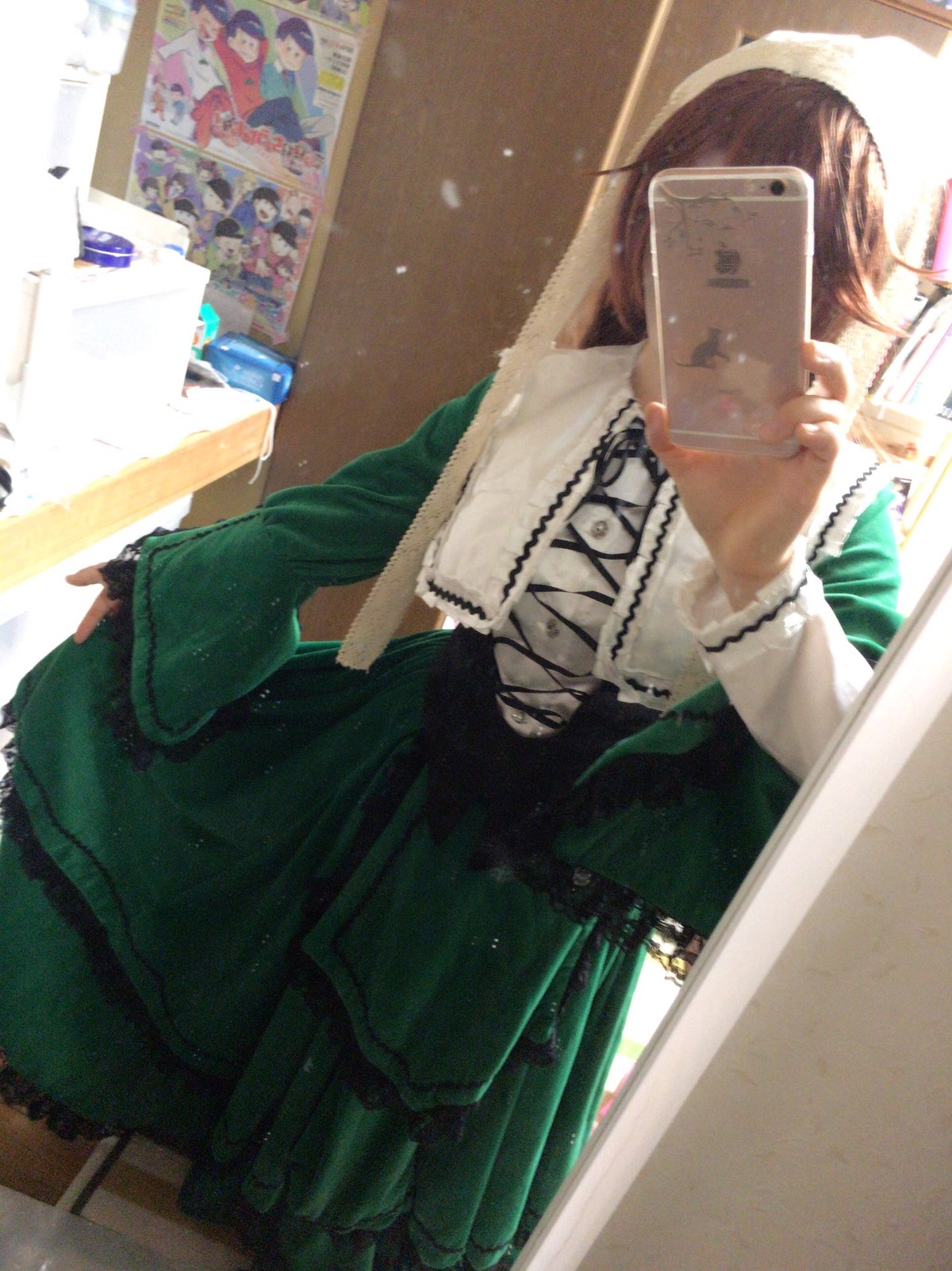 1girl cellphone dress green_dress head_out_of_frame long_sleeves phone photo_(object) solo suiseiseki