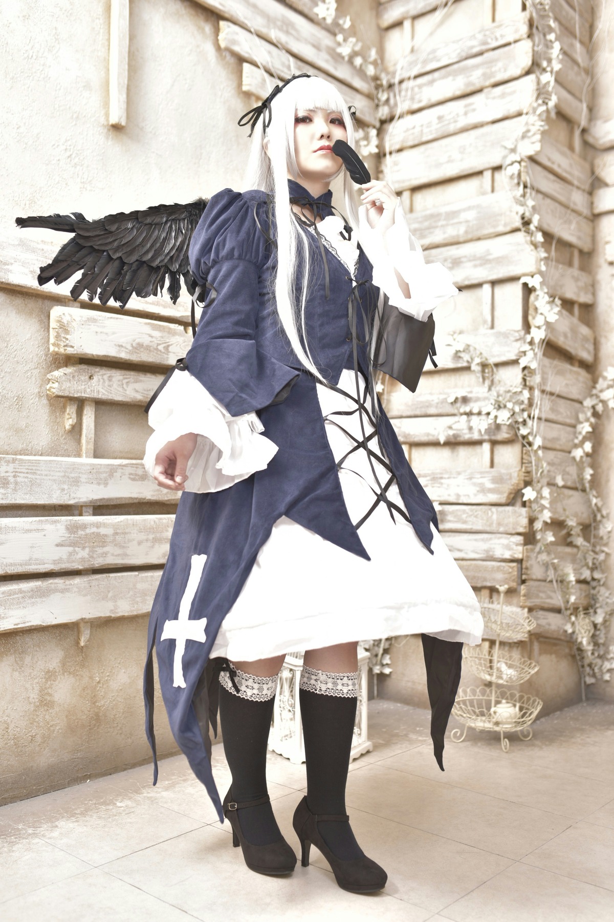 1girl black_legwear boots feathers long_hair ribbon solo standing suigintou thighhighs white_hair wings