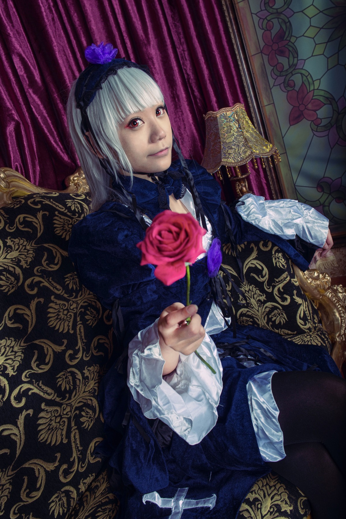 1girl bangs closed_mouth dress flower frilled_sleeves frills gothic_lolita hairband lolita_fashion long_sleeves looking_at_viewer nail_polish red_eyes rose sitting solo suigintou