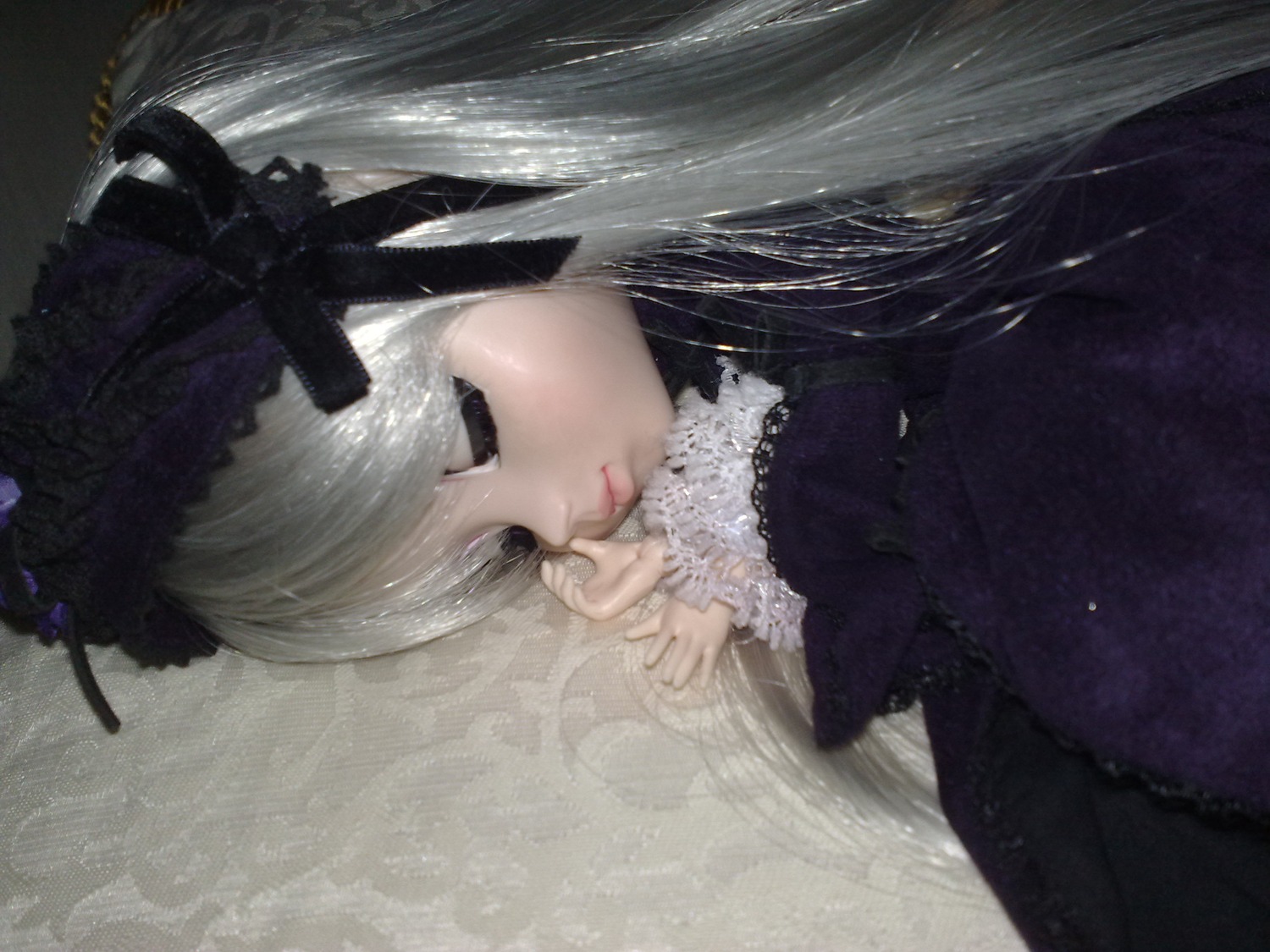 1girl bangs black_dress black_eyes closed_mouth doll dress eyelashes flower frills gothic_lolita hair_ornament lace lips lolita_fashion long_hair long_sleeves nail_polish profile ribbon solo suigintou upper_body