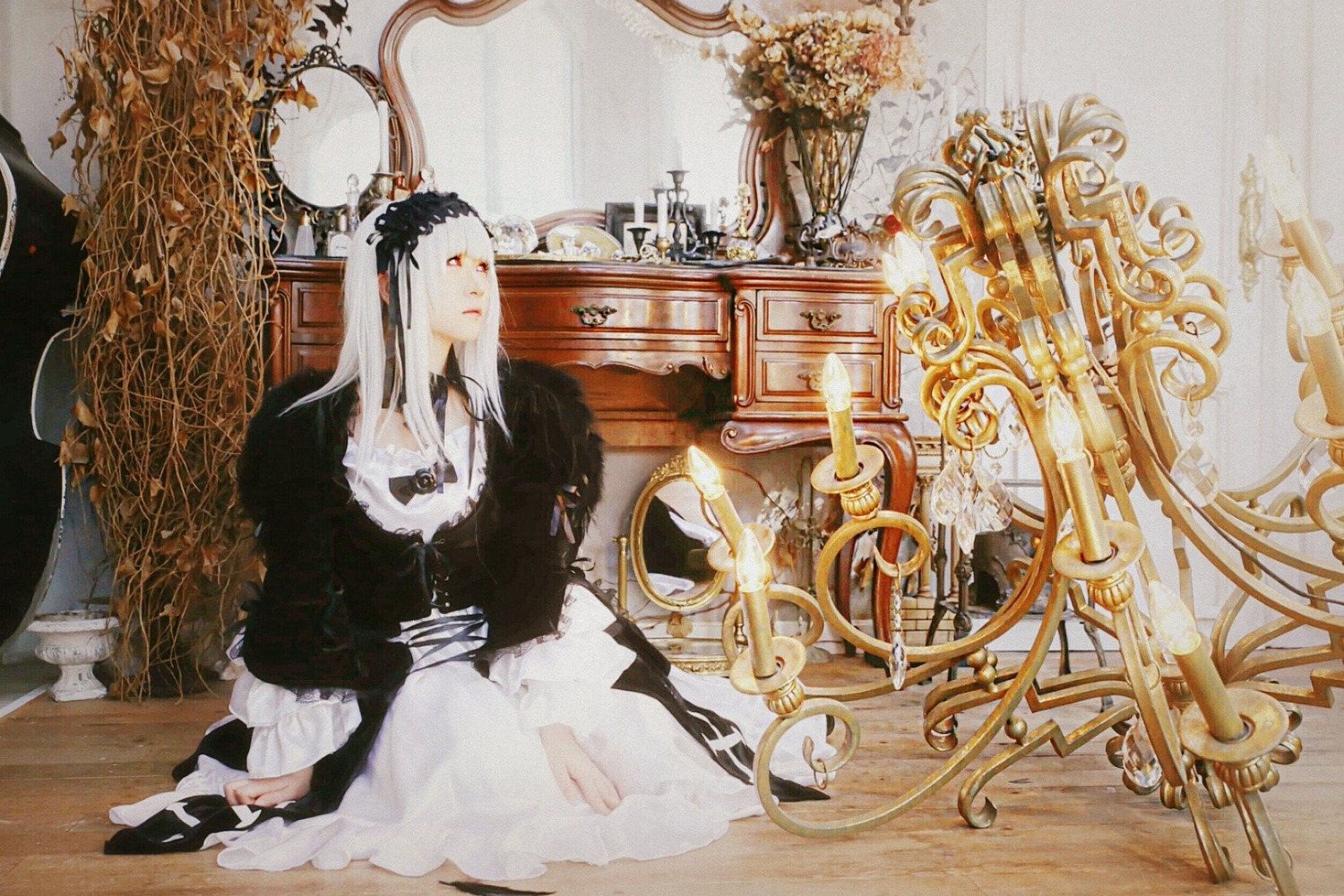 1girl black_dress dress long_hair long_sleeves sitting solo suigintou torn_clothes white_hair