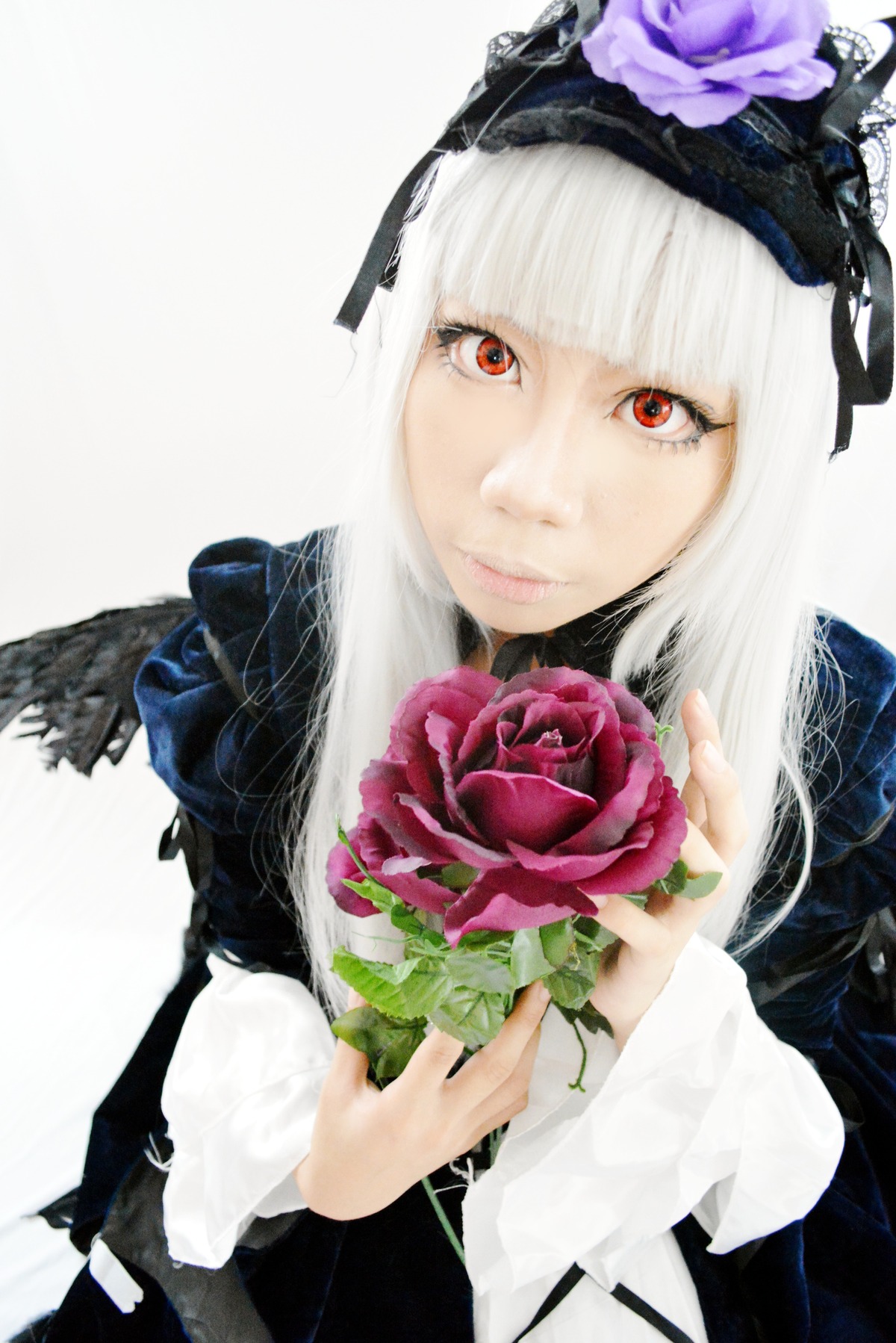 1girl bangs bouquet flower gothic_lolita lips long_hair looking_at_viewer red_eyes red_flower red_rose rose simple_background solo suigintou upper_body white_hair