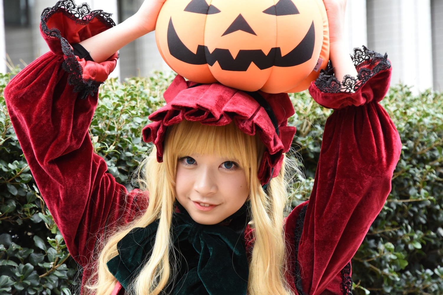 1girl bangs blonde_hair blue_eyes dress flower jack-o'-lantern lips lipstick long_hair looking_at_viewer makeup pumpkin realistic shinku smile solo