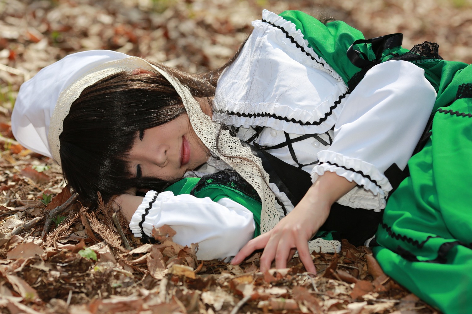 1girl bangs black_hair blurry closed_eyes depth_of_field hat head_scarf lace lips long_sleeves lying on_side photo solo suiseiseki