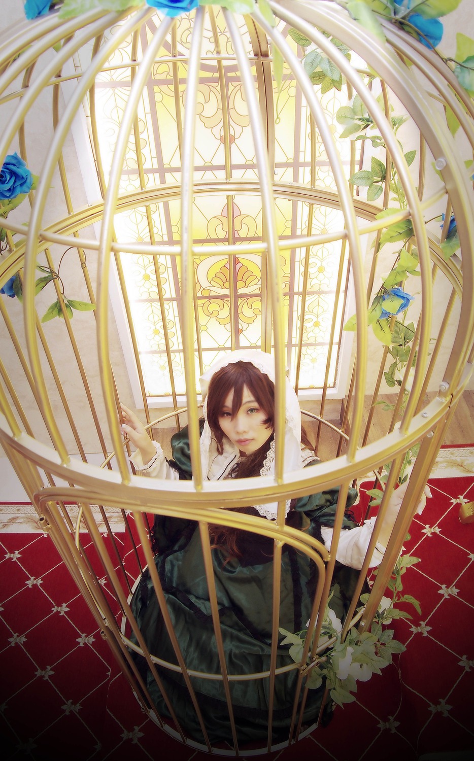 1girl blue_flower blue_rose brown_hair closed_eyes dress flower indoors long_hair plant rose sitting solo stained_glass suiseiseki window