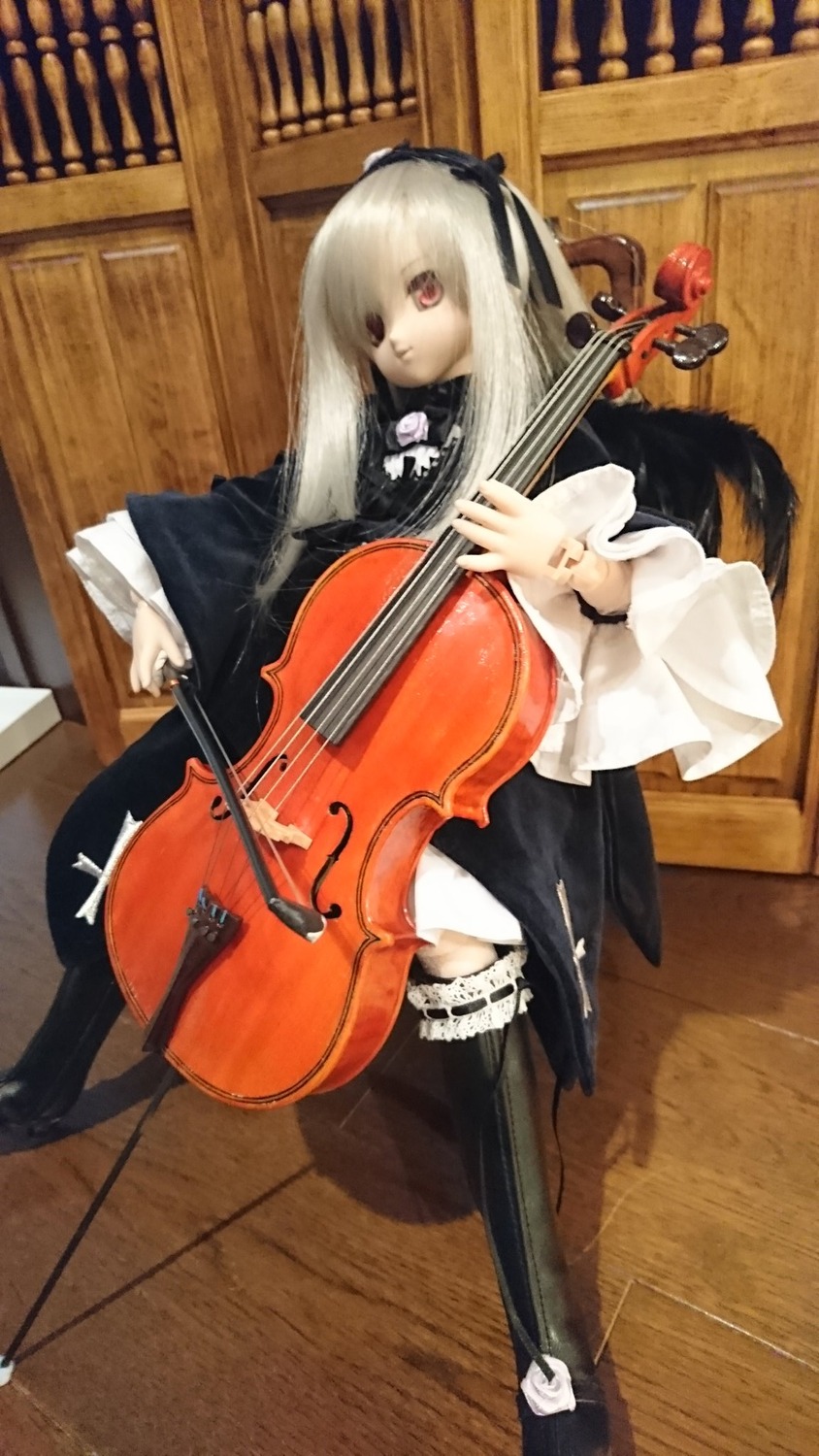 1girl acoustic_guitar bass_guitar bow_(instrument) doll dress electric_guitar guitar holding_instrument instrument long_hair music piano playing_instrument plectrum red_eyes sheet_music solo suigintou thighhighs violin white_hair