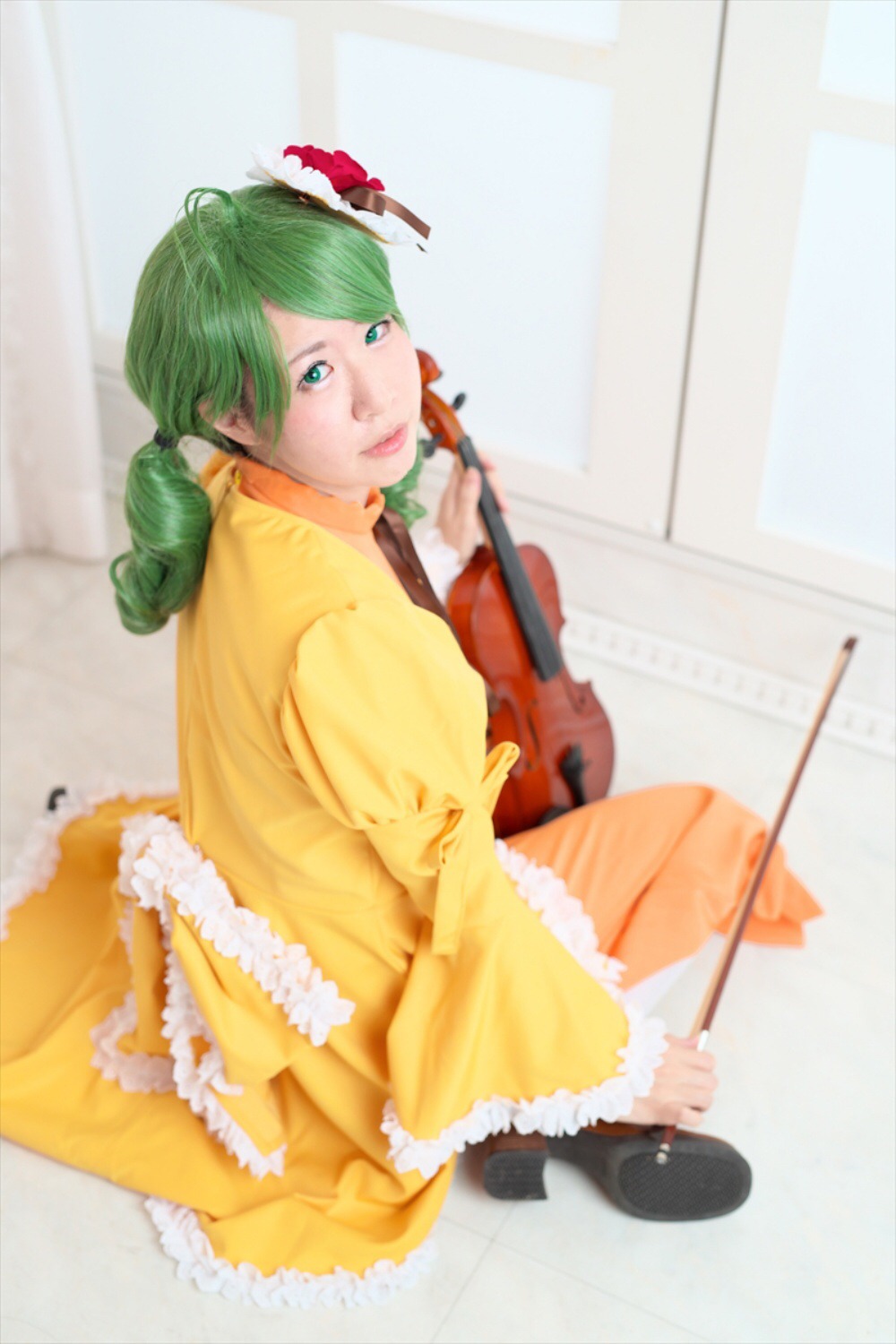 1girl black_footwear blurry depth_of_field dress flower full_body green_hair instrument kanaria lips looking_at_viewer shoes solo yellow_dress