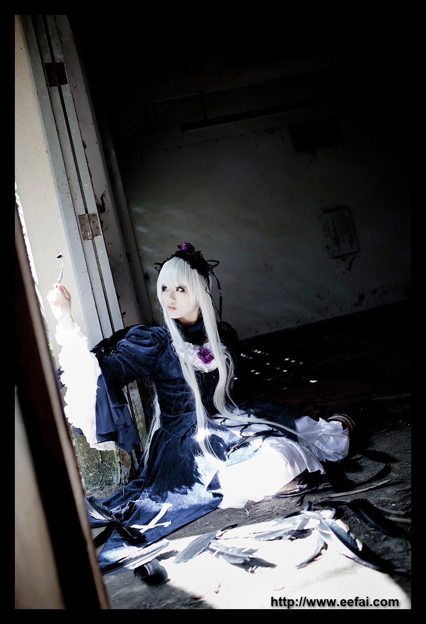 1girl blue_eyes dress long_hair sitting solo suigintou