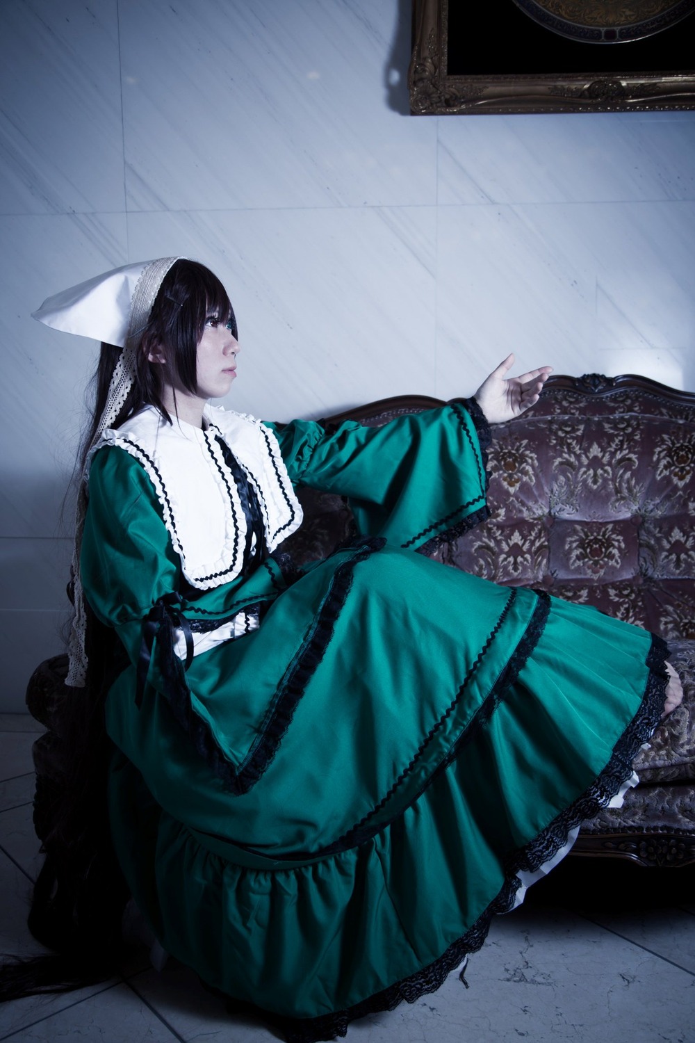 1girl black_hair dress green_dress long_hair long_sleeves sitting solo suiseiseki