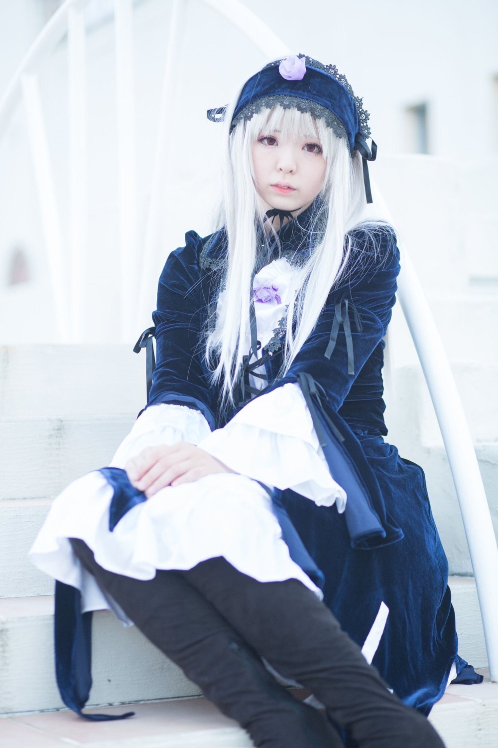 1girl bangs black_legwear blurry boots dress frills hat lips long_hair long_sleeves looking_at_viewer musical_note photo sitting solo suigintou white_hair