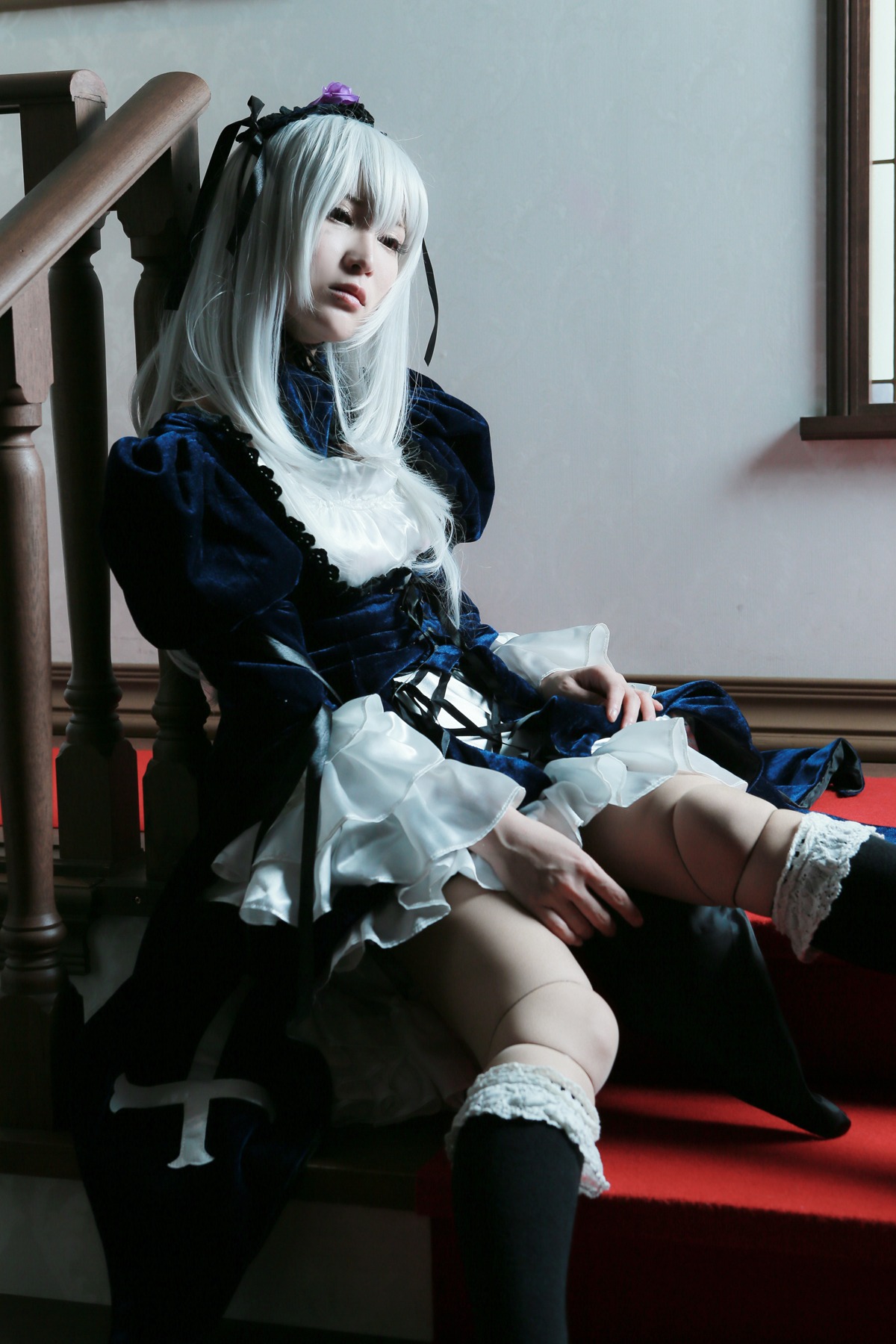 1girl boots chair doll_joints dress frills gothic_lolita hairband knee_boots lips lolita_fashion long_sleeves silver_hair sitting solo suigintou