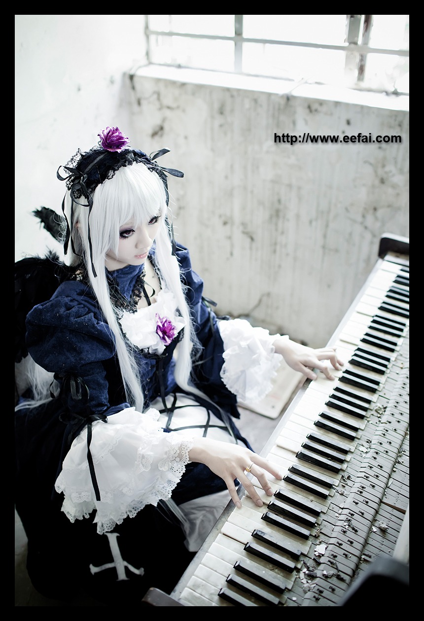 1girl dress feathers flower frills instrument letterboxed music pale_skin piano playing_instrument sheet_music silver_hair solo suigintou wings