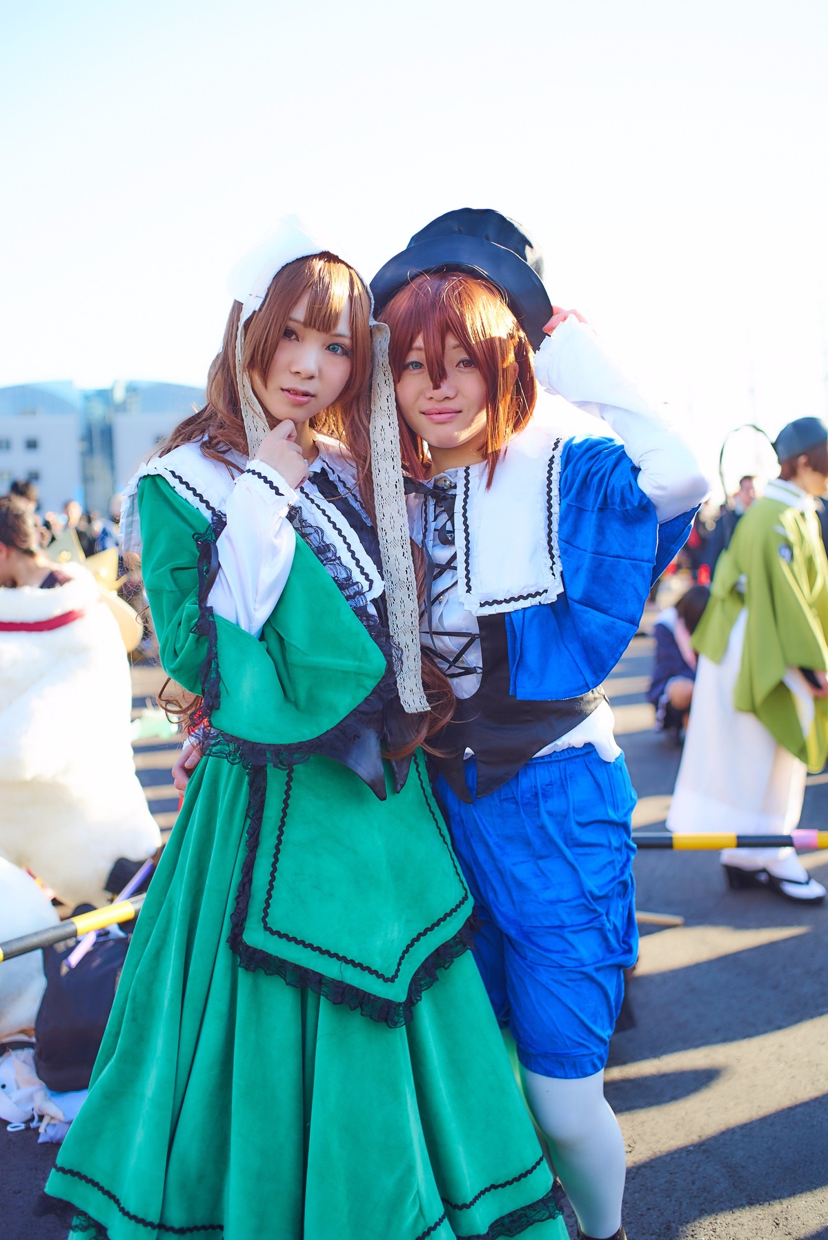 2girls blonde_hair blue_eyes blurry depth_of_field dress gloves hat lips long_hair multiple_cosplay multiple_girls realistic tagme