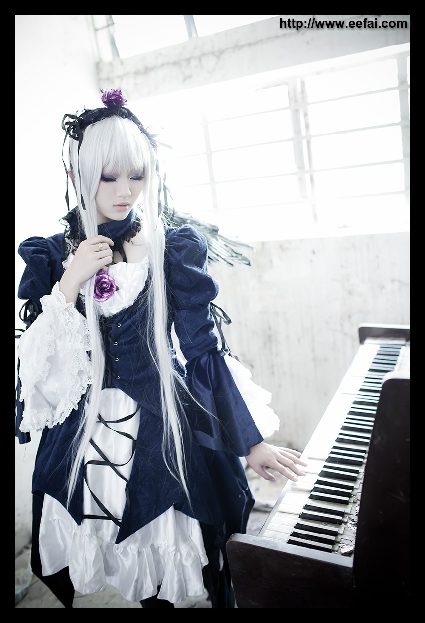 1girl dress flower frills hair_ornament instrument letterboxed long_hair music piano pillarboxed playing_instrument silver_hair solo suigintou very_long_hair wings