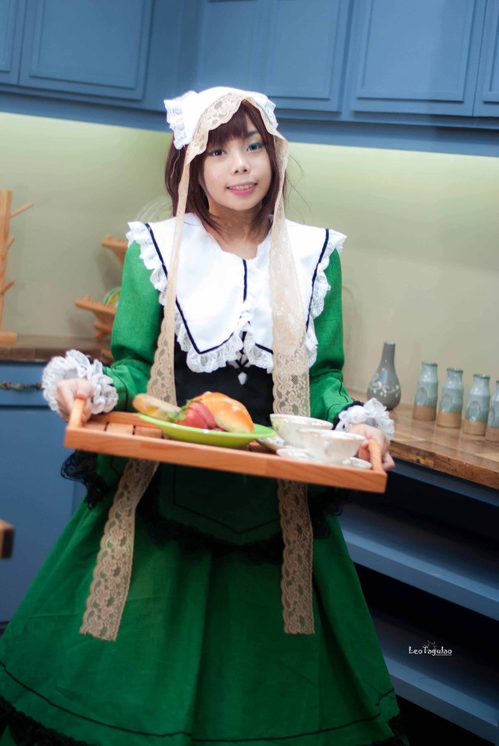 1girl apron artist_name blue_eyes brown_hair dress food green_dress maid plate realistic signature smile solo suiseiseki tray