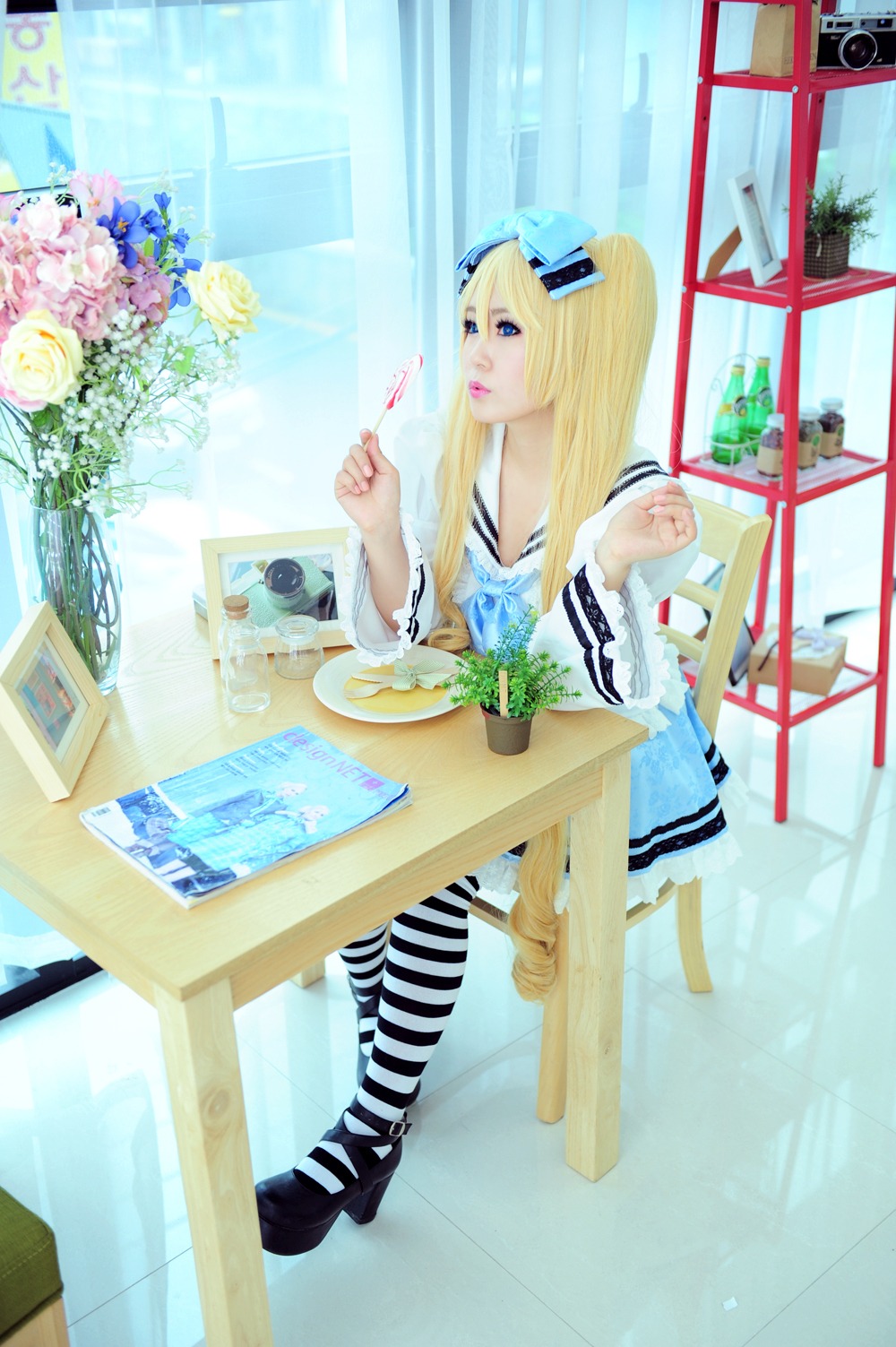 1girl blonde_hair blue_eyes chair flower food lips long_hair photo shinku sitting solo striped striped_legwear