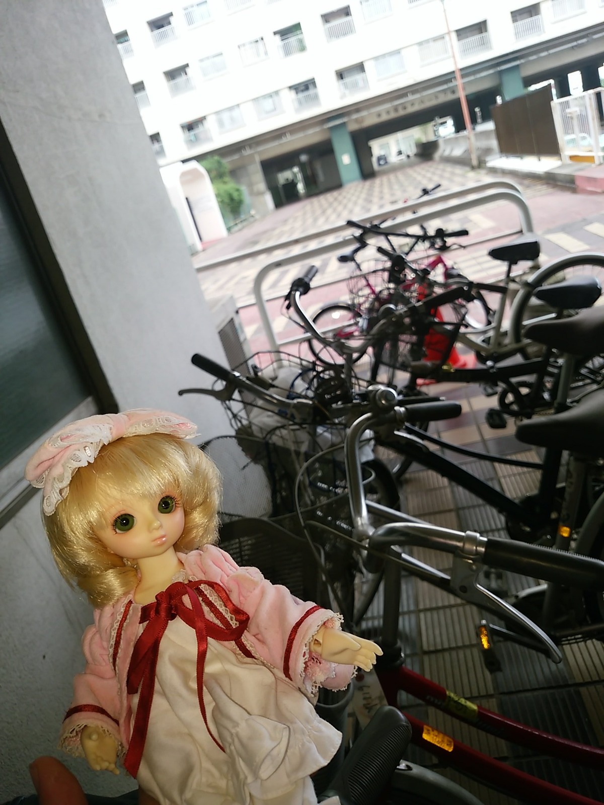 1girl bicycle blonde_hair doll dress hat hinaichigo long_sleeves looking_at_viewer ribbon short_hair solo