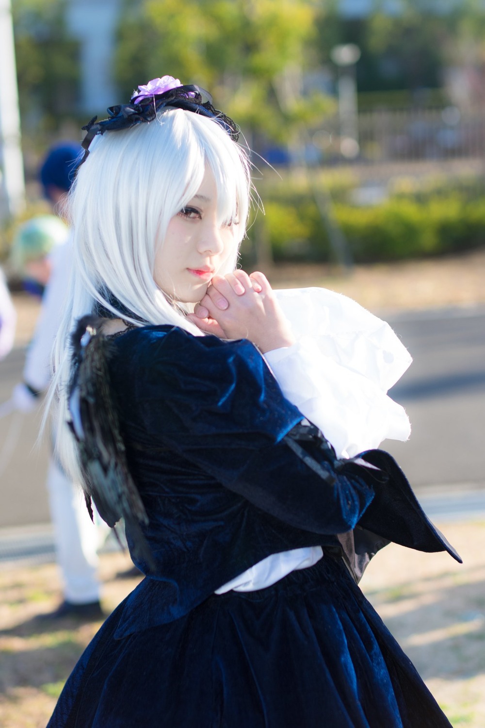 1girl 3d black_skirt blurry blurry_background blurry_foreground closed_mouth depth_of_field hairband long_hair long_sleeves looking_at_viewer photo photo_background school_uniform skirt solo suigintou white_hair