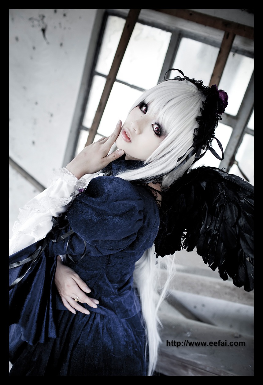 1girl black_border black_wings doll_joints dress feathers gothic_lolita hairband letterboxed lips lolita_fashion lolita_hairband long_sleeves looking_at_viewer solo suigintou window wings