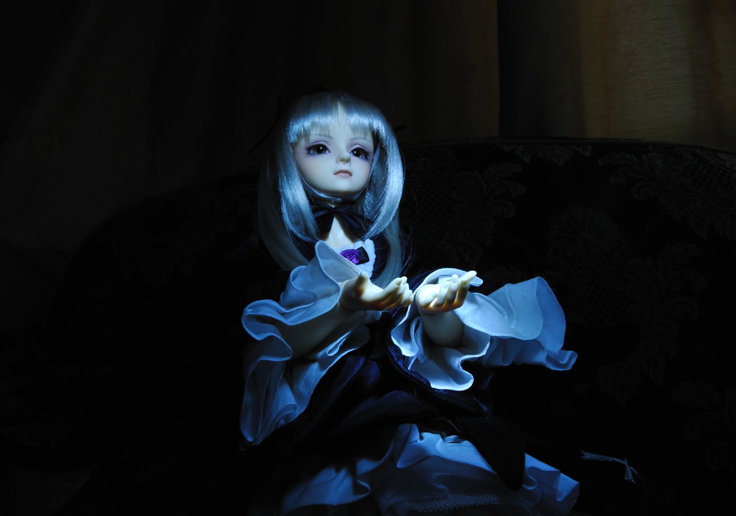 1girl dark doll dress holding long_hair long_sleeves sitting solo suigintou