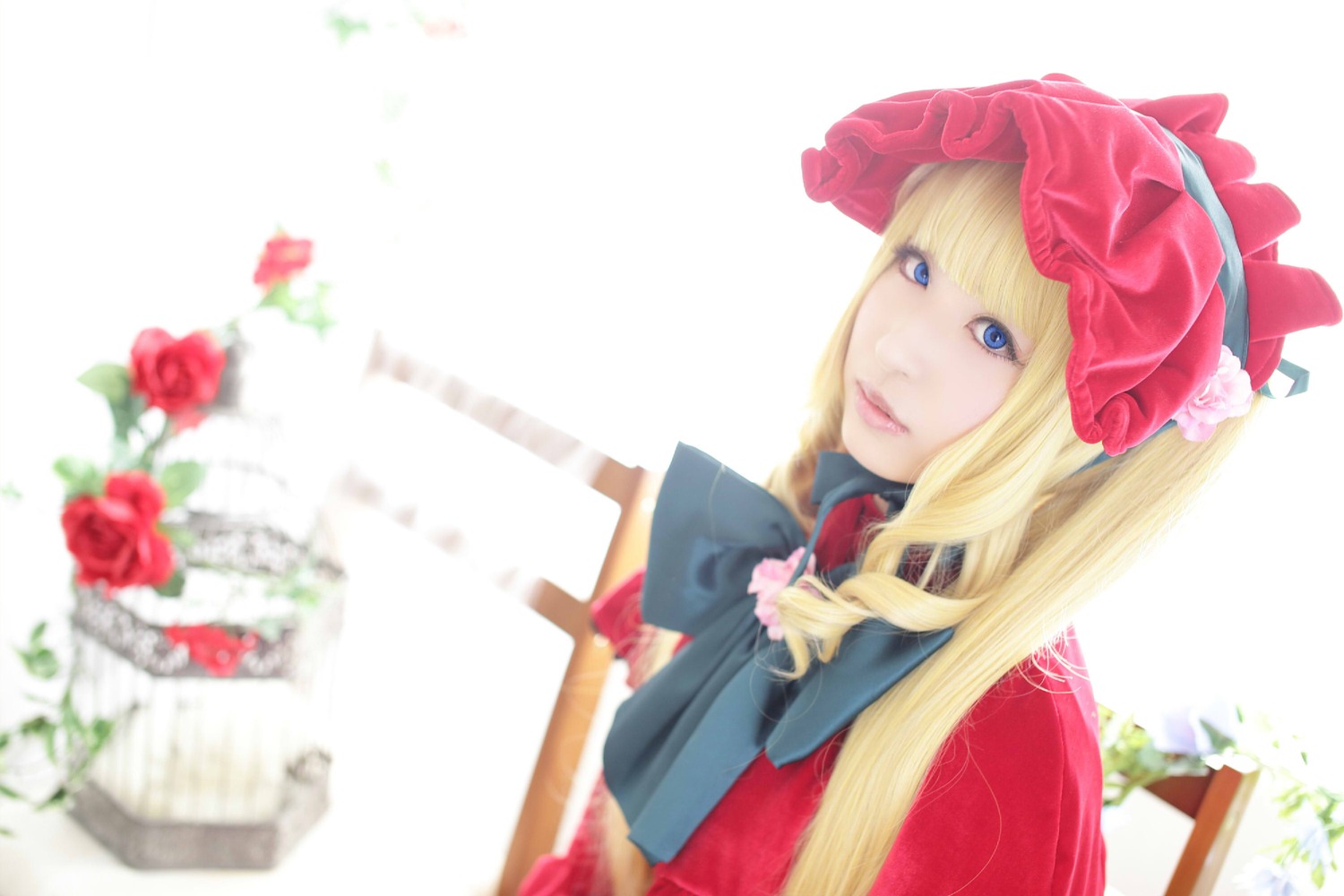1girl bangs blonde_hair blue_eyes blurry blurry_foreground bow depth_of_field flower hat lips long_hair red_flower red_rose rose shinku solo striped