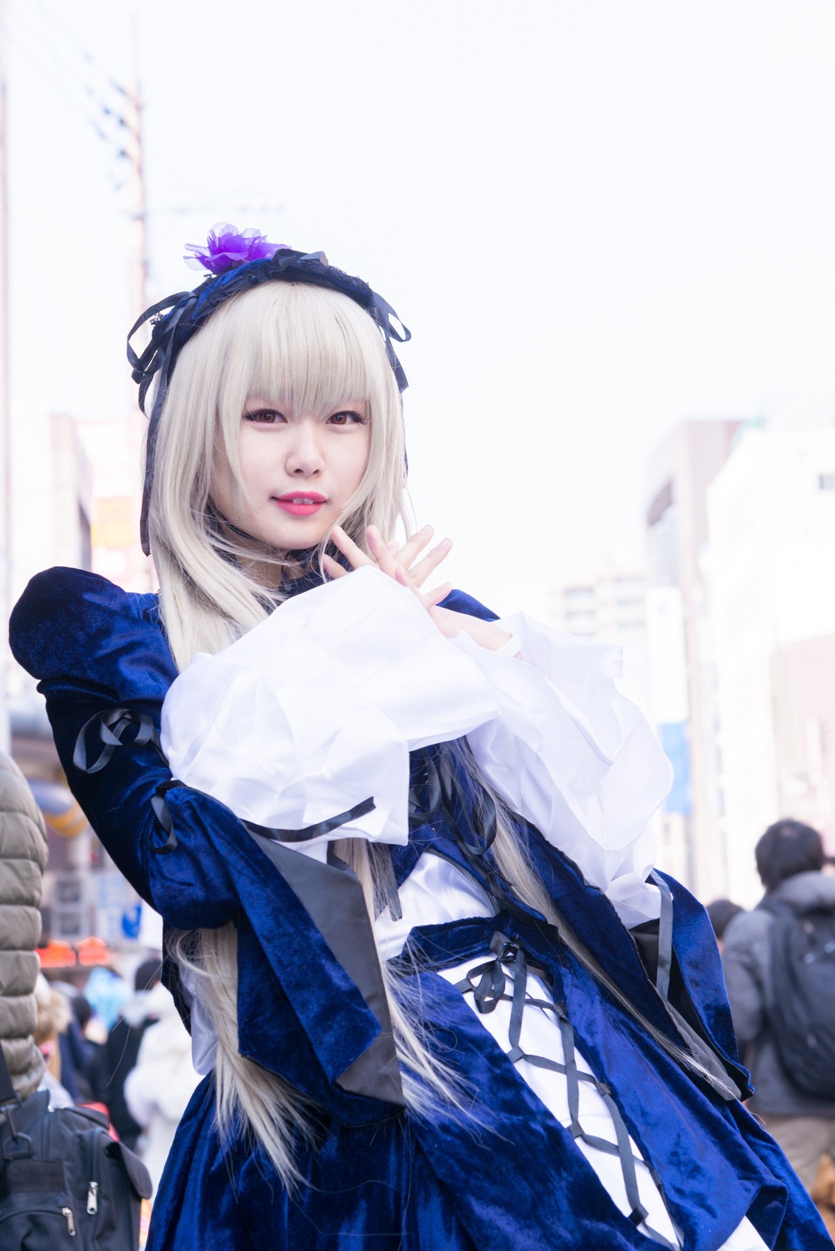 1girl 3d bangs blurry blurry_background depth_of_field dress flower hairband lips lipstick long_hair long_sleeves looking_at_viewer photo solo suigintou