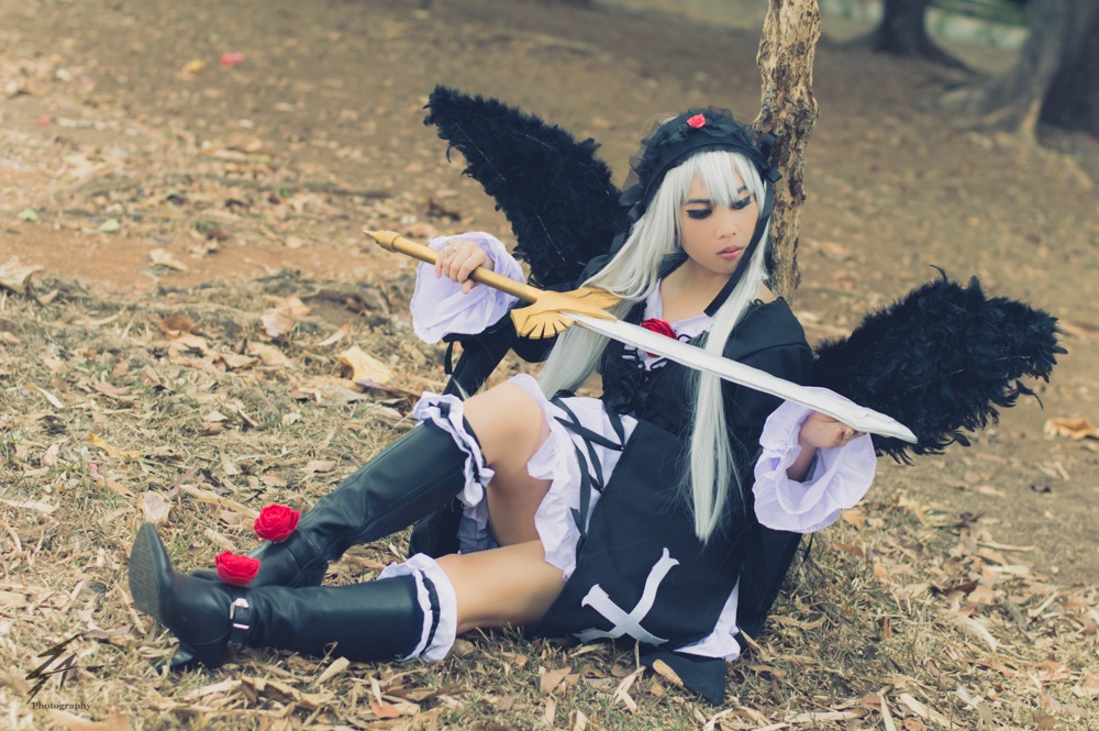 1girl blue_eyes boots dress flower frills long_hair long_sleeves on_ground sitting solo suigintou white_hair