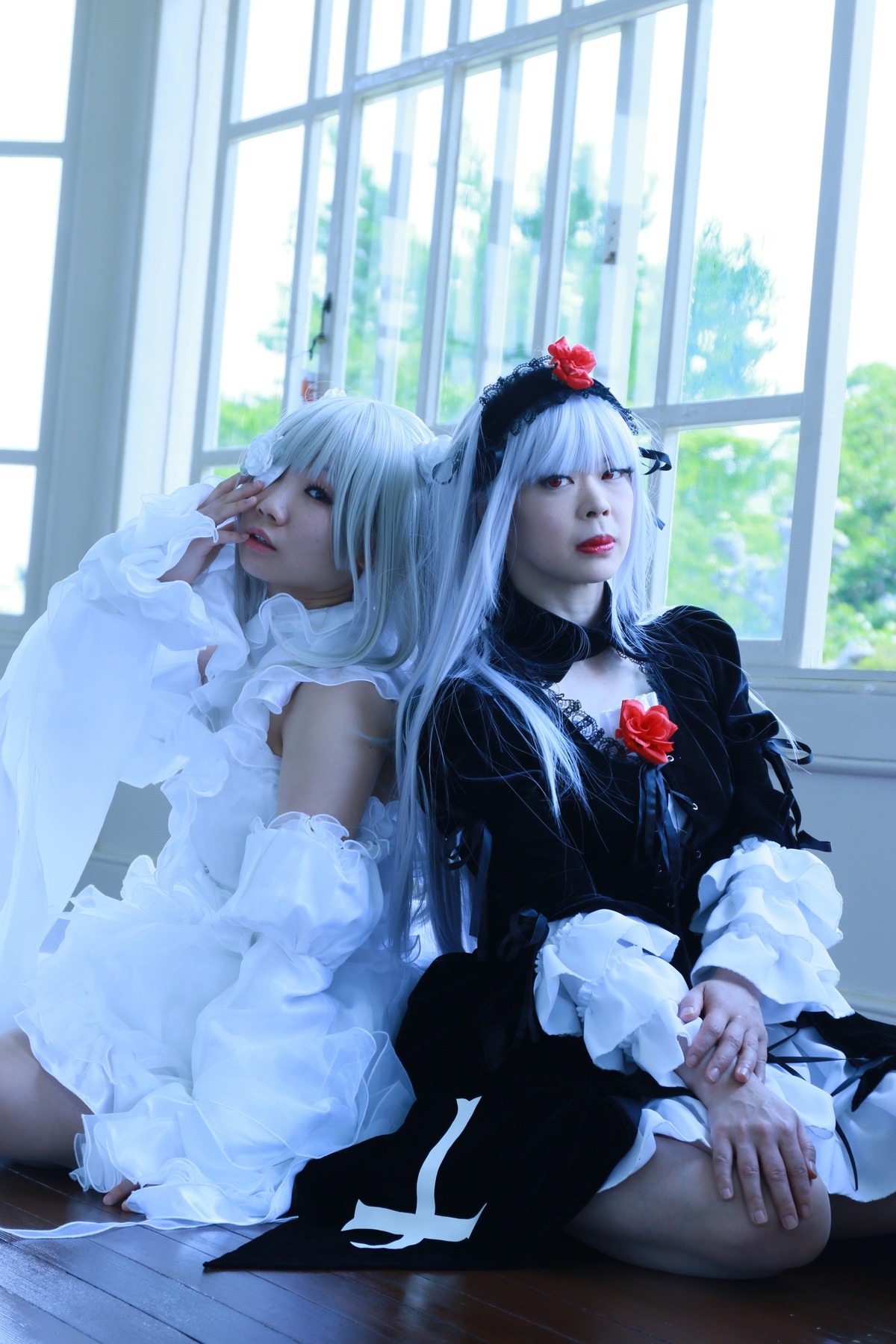 2girls bangs black_dress dress flower frills gothic_lolita indoors lips lolita_fashion long_hair long_sleeves multiple_cosplay multiple_girls rose sitting tagme white_hair wide_sleeves window