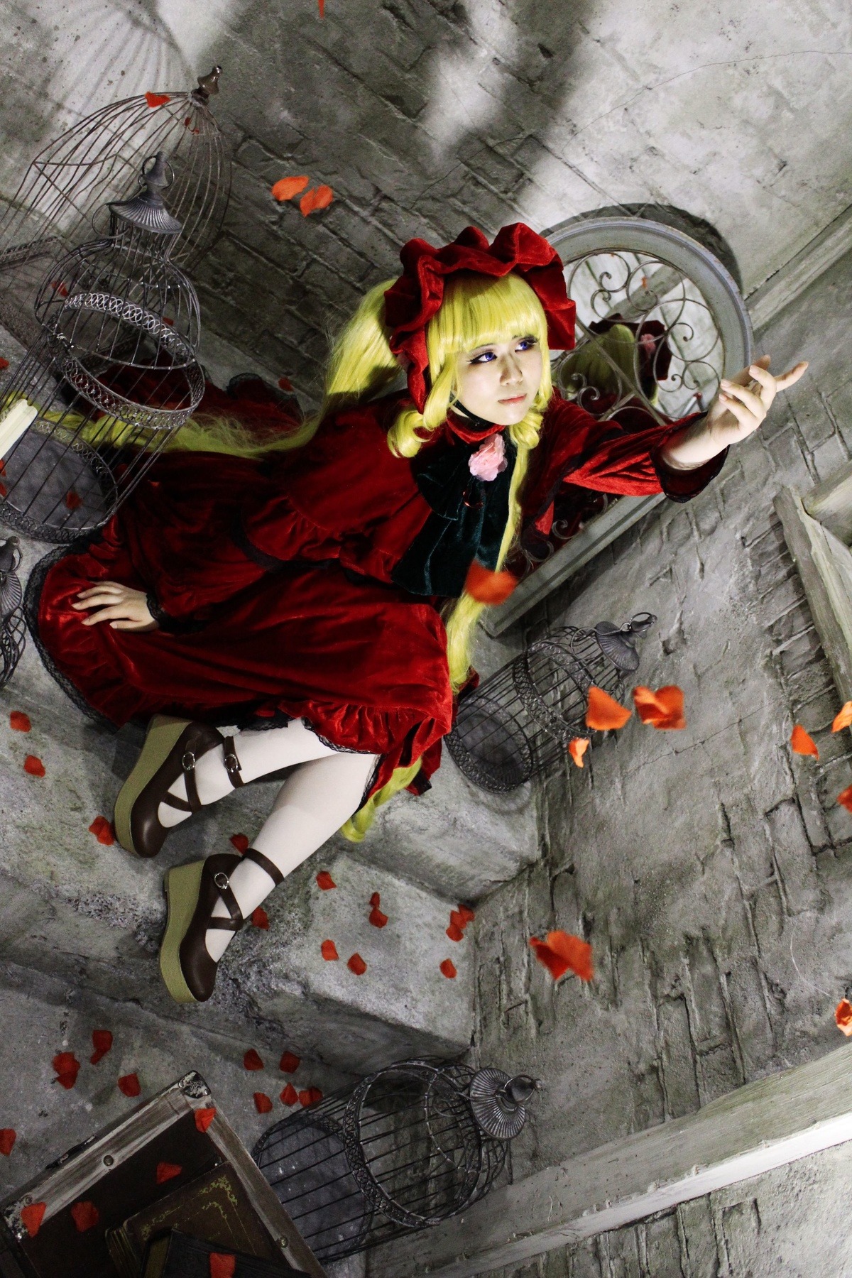 1girl blonde_hair blue_eyes dress flower mary_janes petals red_dress ribbon rose shinku shoes sitting solo