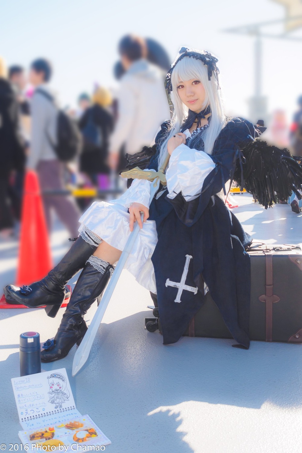 1girl blurry blurry_background blurry_foreground boots depth_of_field dress knee_boots long_hair photo sitting solo suigintou