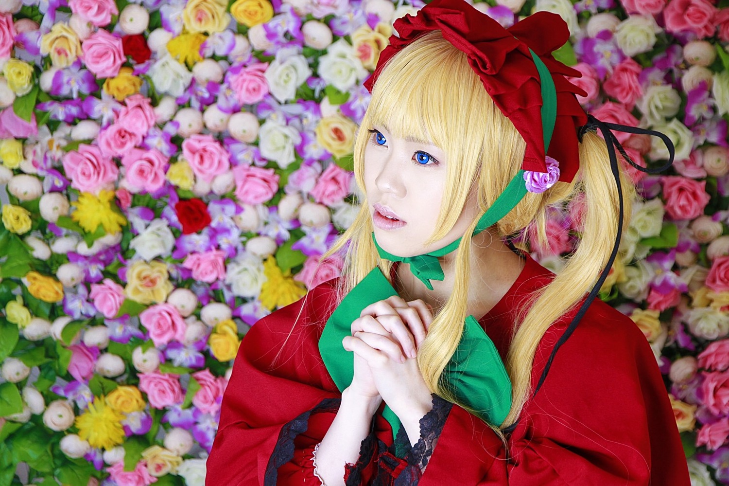 1girl blonde_hair blue_eyes blurry bonnet bouquet depth_of_field dress flower green_neckwear lips long_hair pink_flower pink_rose purple_flower purple_rose red_capelet red_dress rose shinku sidelocks solo white_flower white_rose yellow_flower yellow_rose