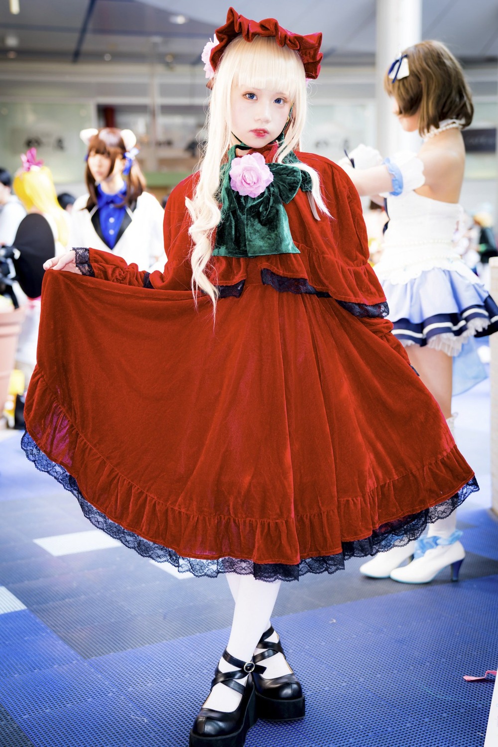 4girls black_footwear blonde_hair blue_dress blue_eyes blurry blurry_background bonnet bow brown_hair depth_of_field dress flower frills hat long_hair long_sleeves looking_at_viewer multiple_girls pantyhose photo red_dress shinku shoes solo standing white_legwear