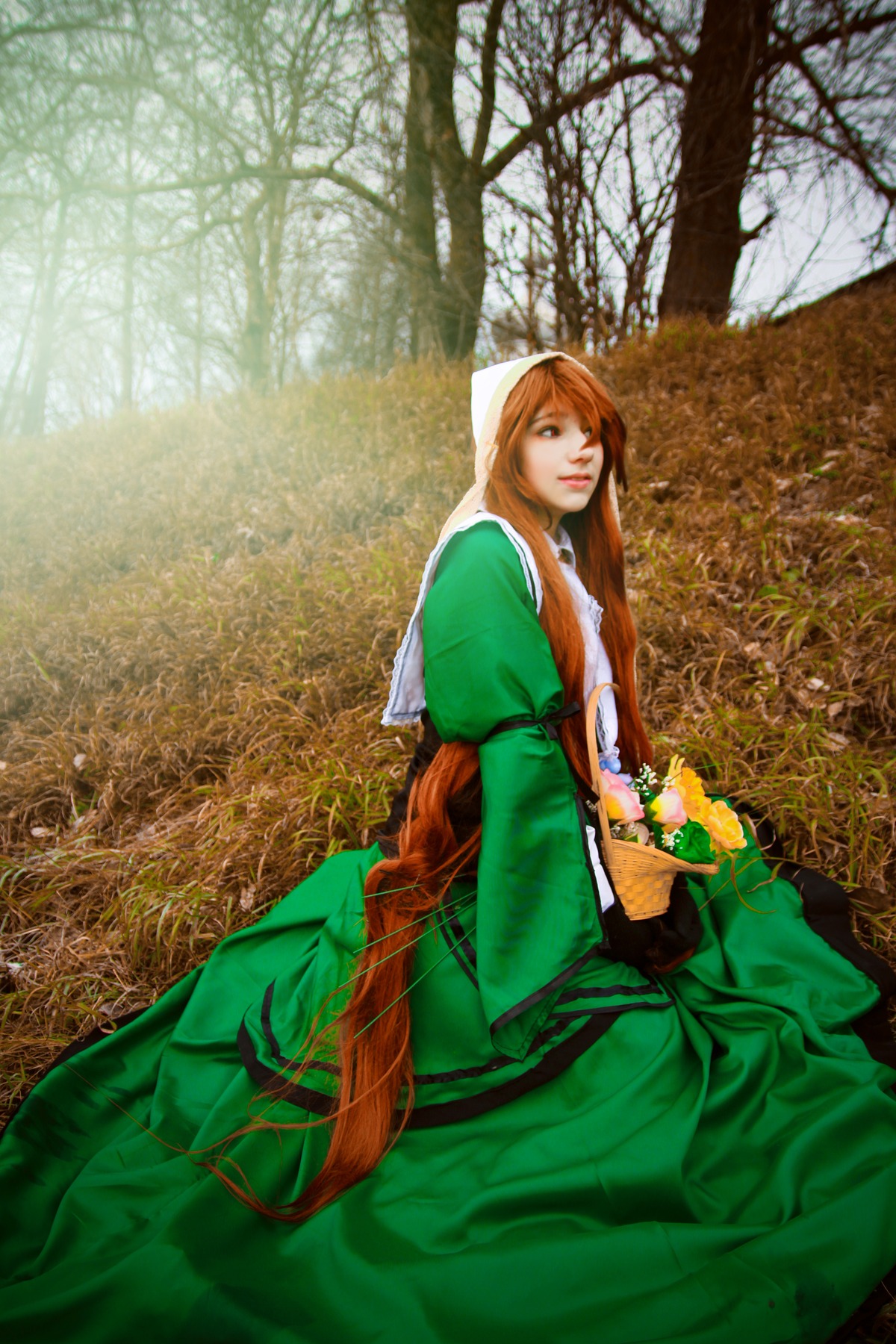 1girl brown_hair dress green_dress head_scarf long_hair long_sleeves looking_at_viewer sitting solo suiseiseki tree