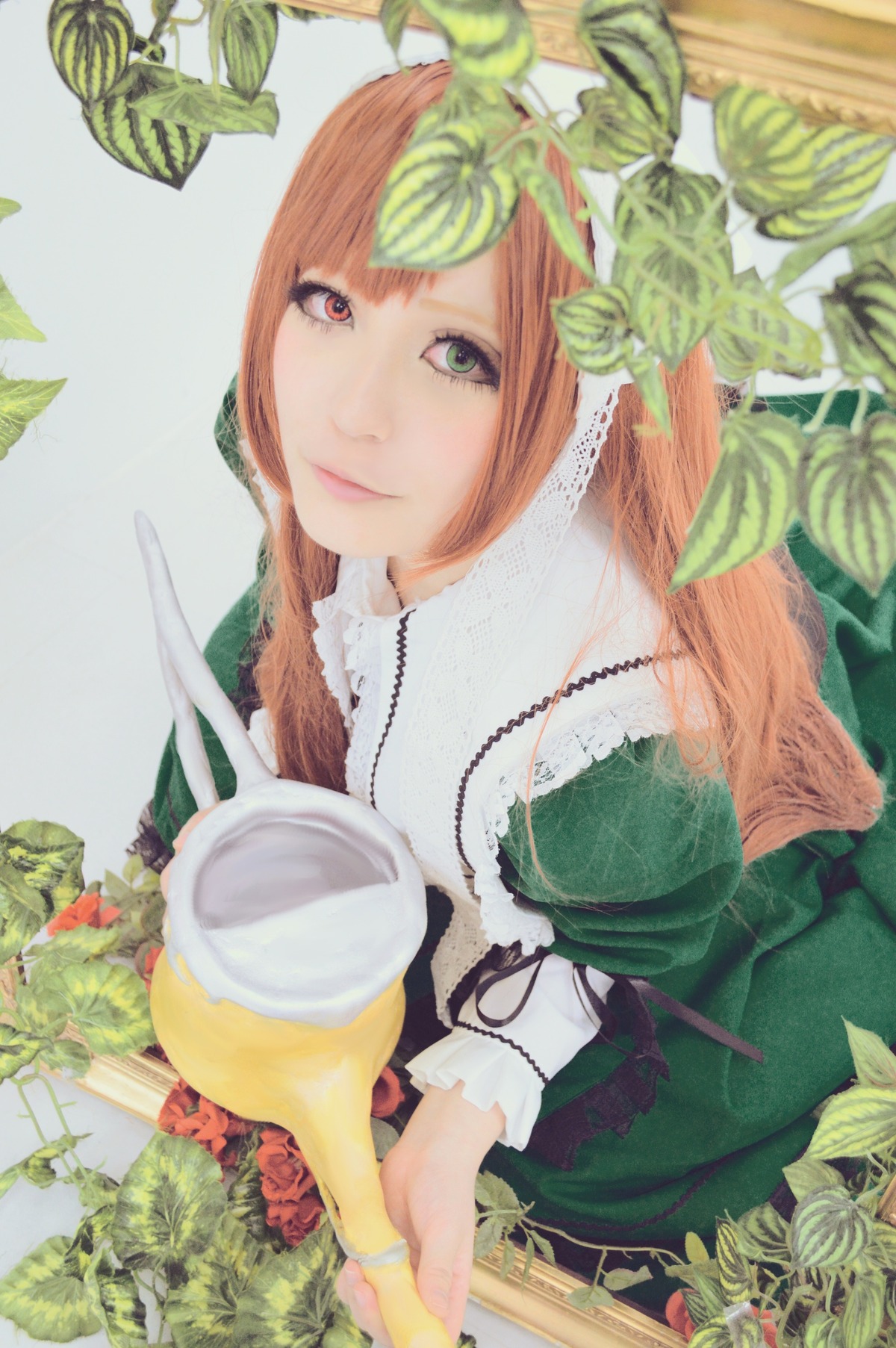 1girl bangs food green_eyes heterochromia leaf long_hair looking_at_viewer plant smile solo suiseiseki