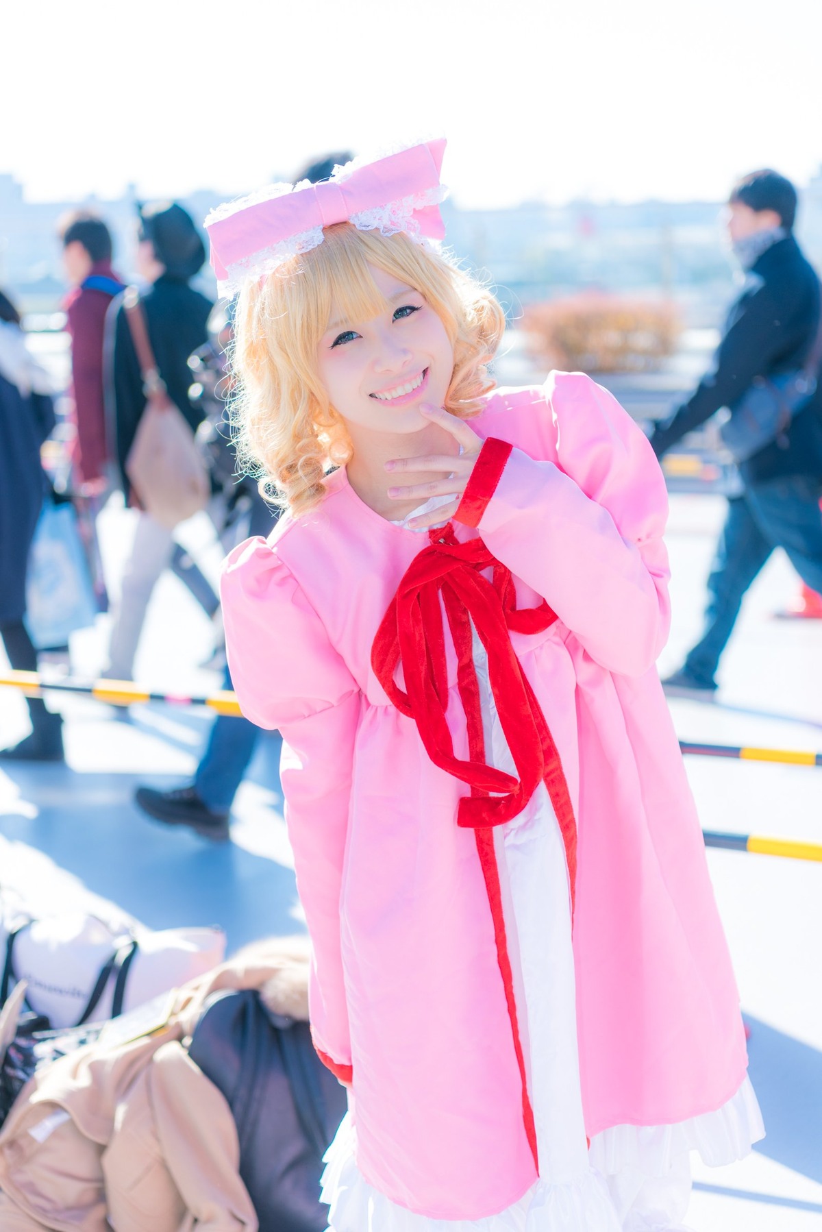 1girl blonde_hair blurry blurry_background blurry_foreground depth_of_field dress hat hinaichigo long_sleeves looking_at_viewer multiple_boys outdoors photo ribbon smile solo solo_focus